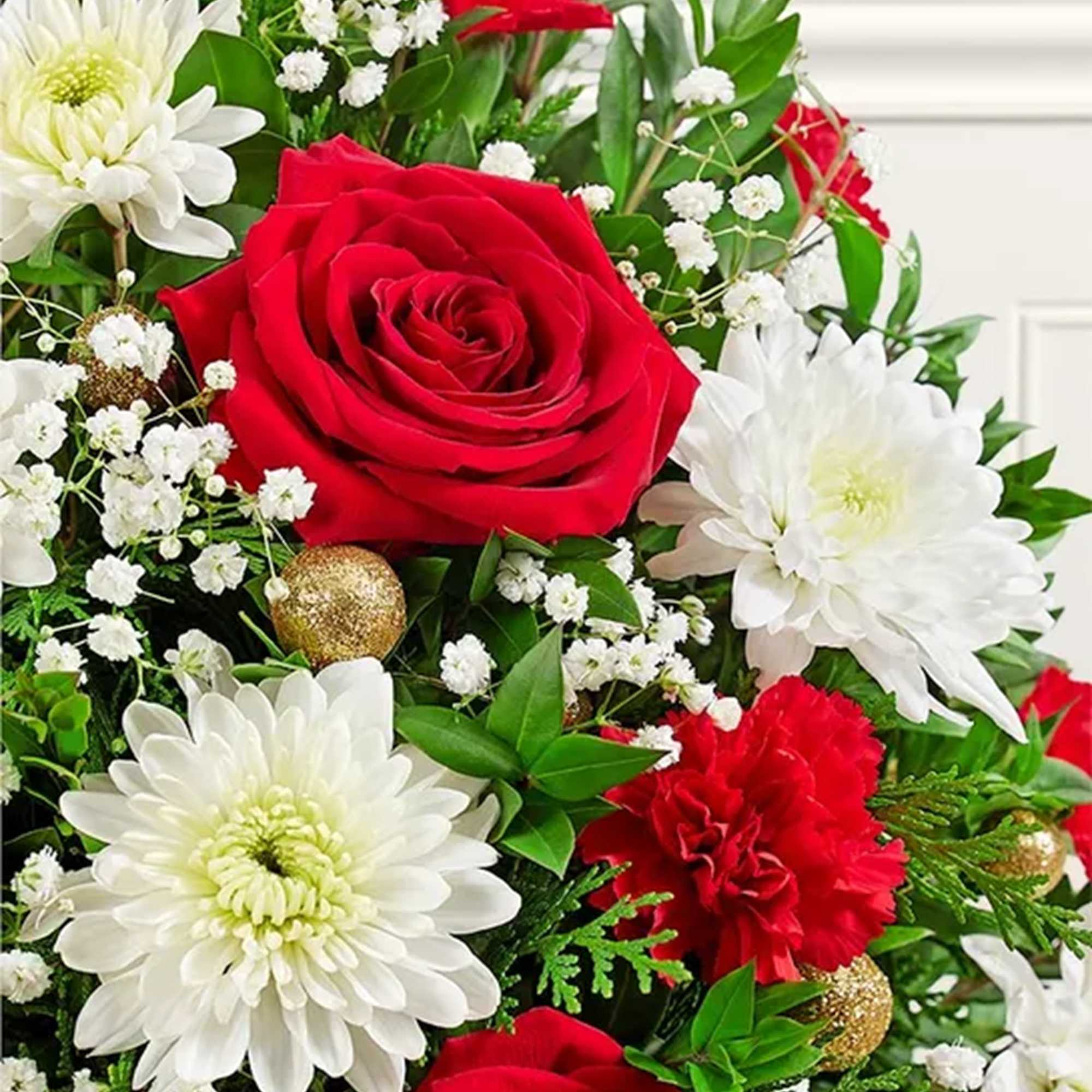 Red roses and white chrysanthemums with baby's breath in a bouquet