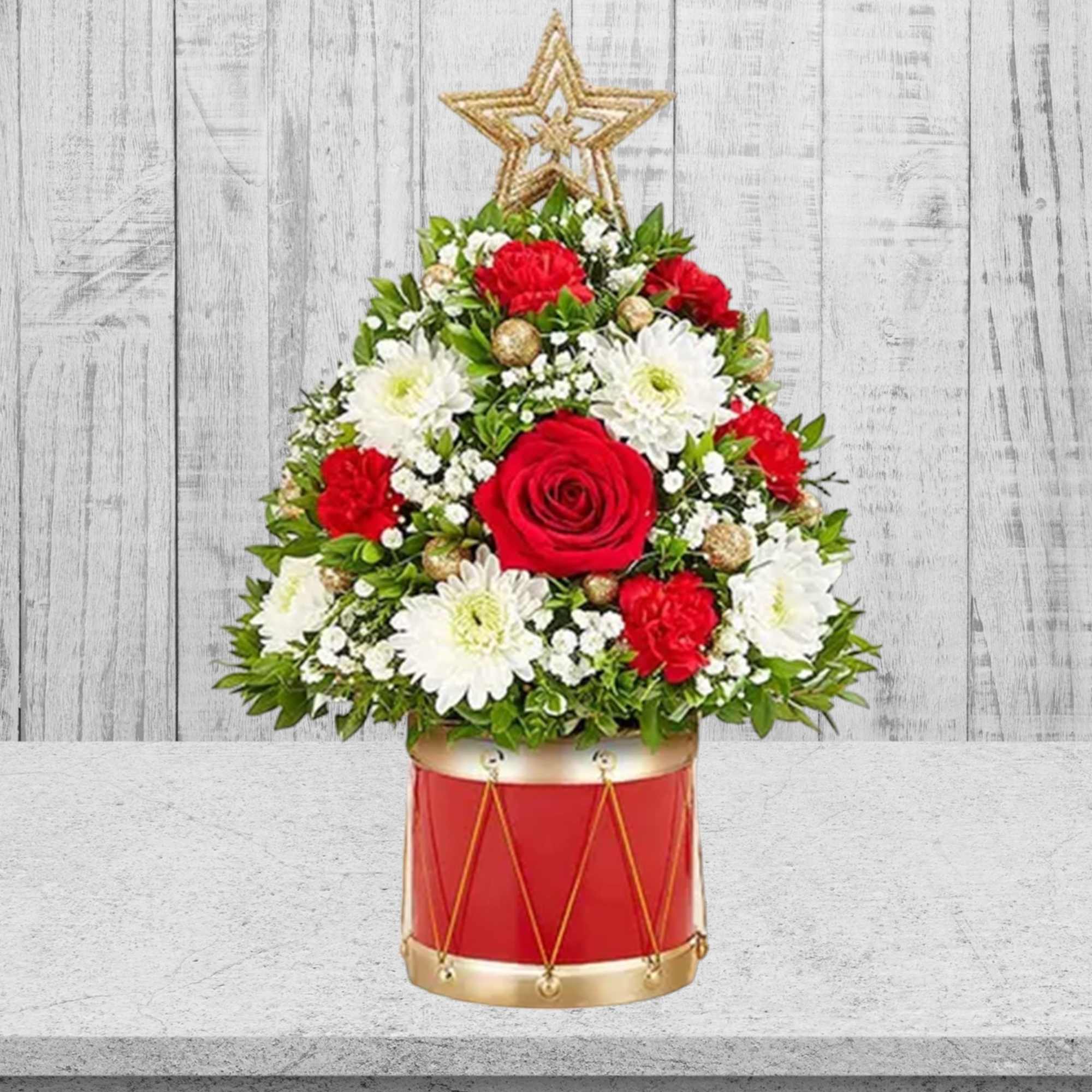 Red and white floral arrangement in a red drum container with a star topper, photo 5 of 5