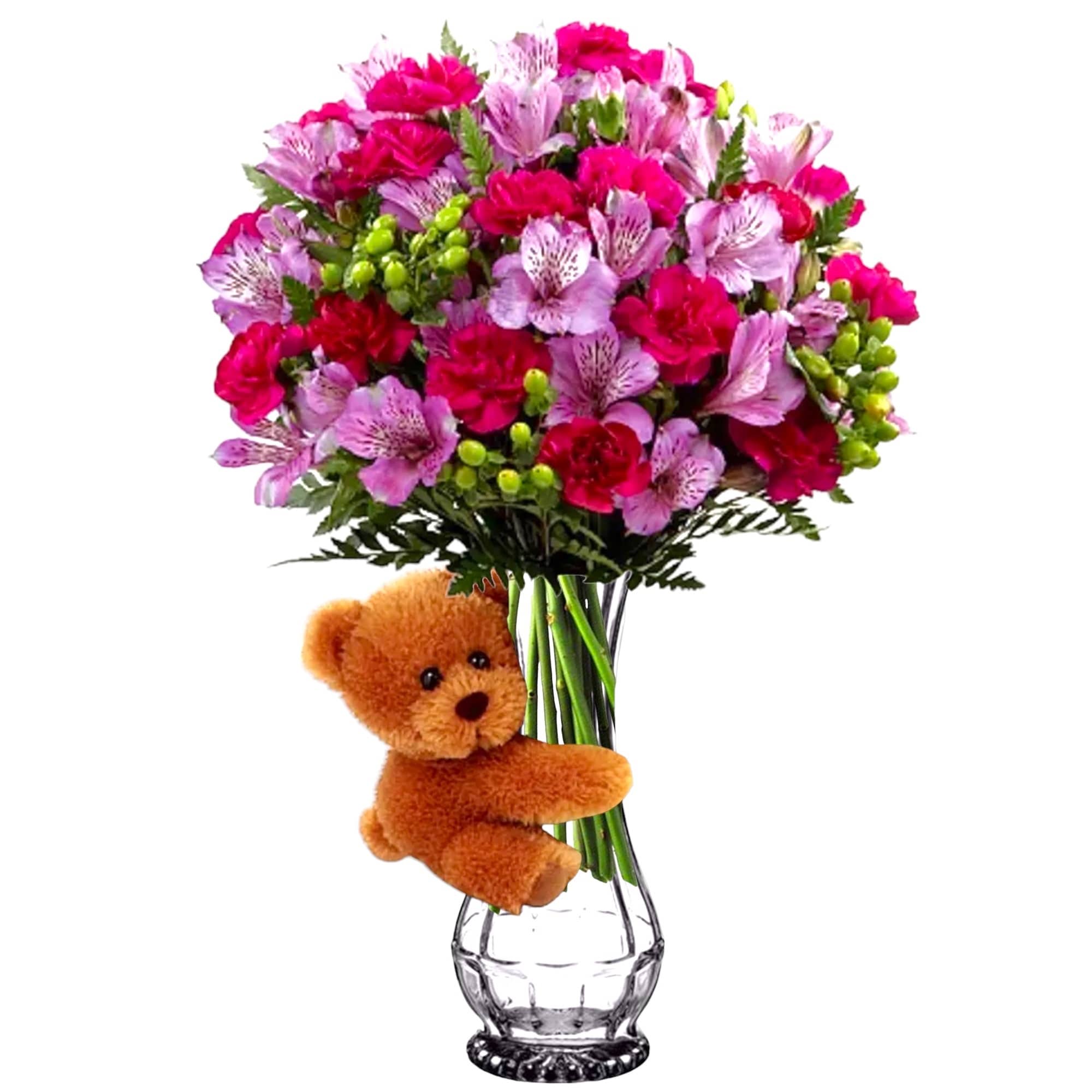 Bouquet of pink and purple flowers in a clear vase with a teddy bear