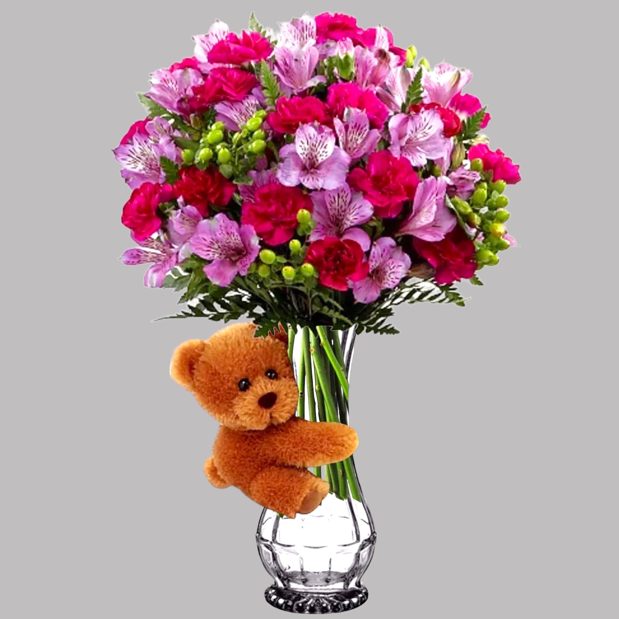 Pink and red bouquet in a clear vase with a teddy bear attached, photo 3 of 3