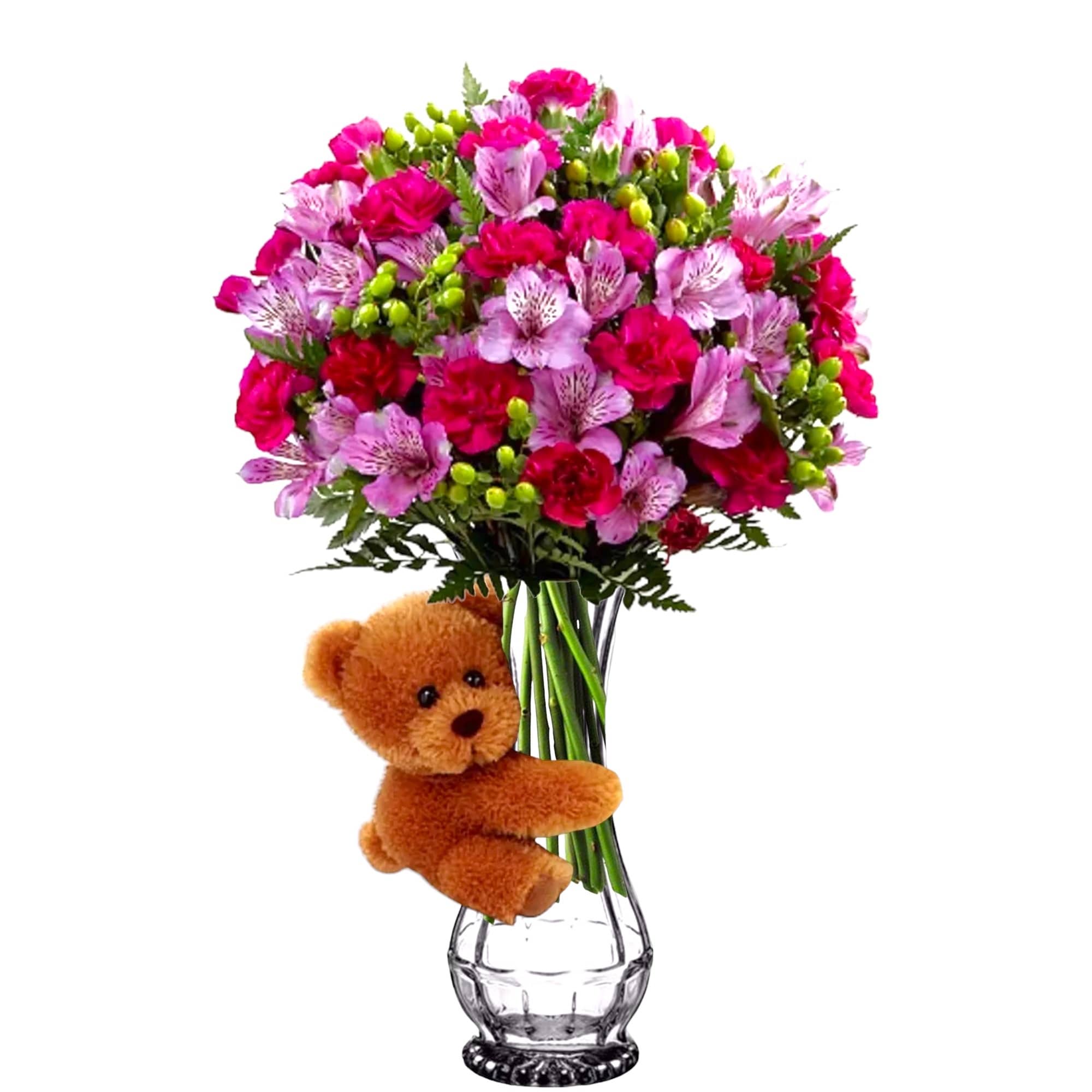 Pink and magenta bouquet in a glass vase with a teddy bear attached