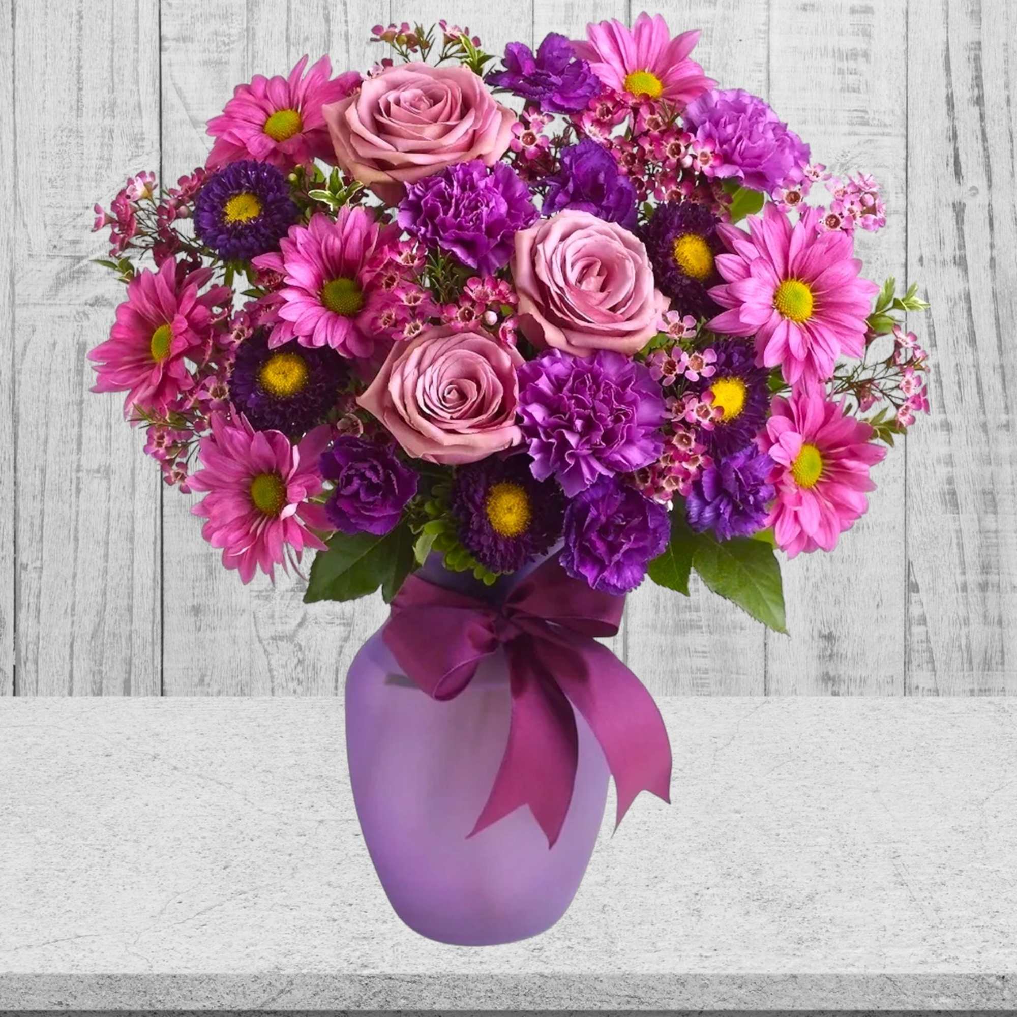 Pink and purple bouquet in a lavender vase with a ribbon, photo 3 of 5