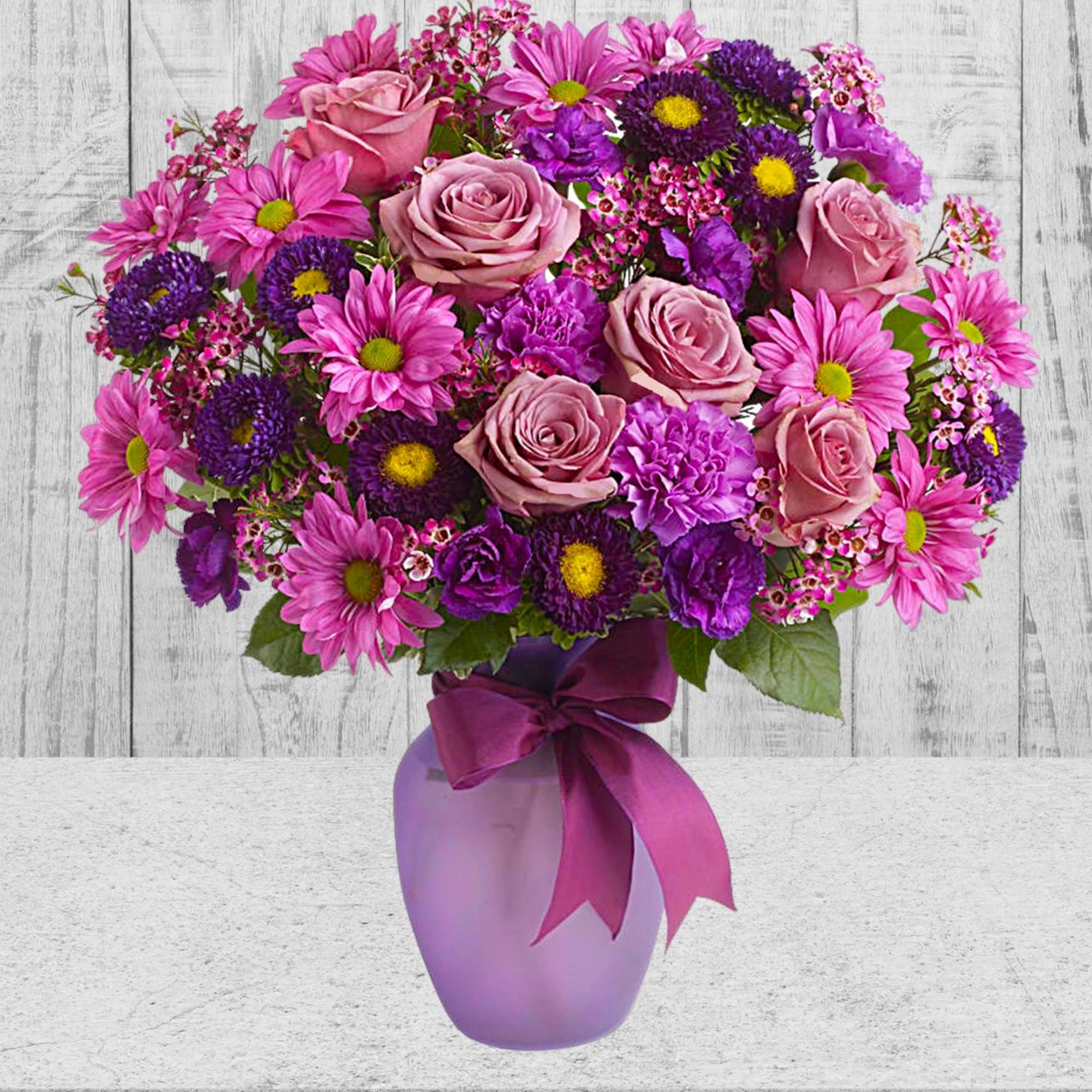 Pink and purple mixed bouquet in a lavender vase with a ribbon, photo 3 of 4