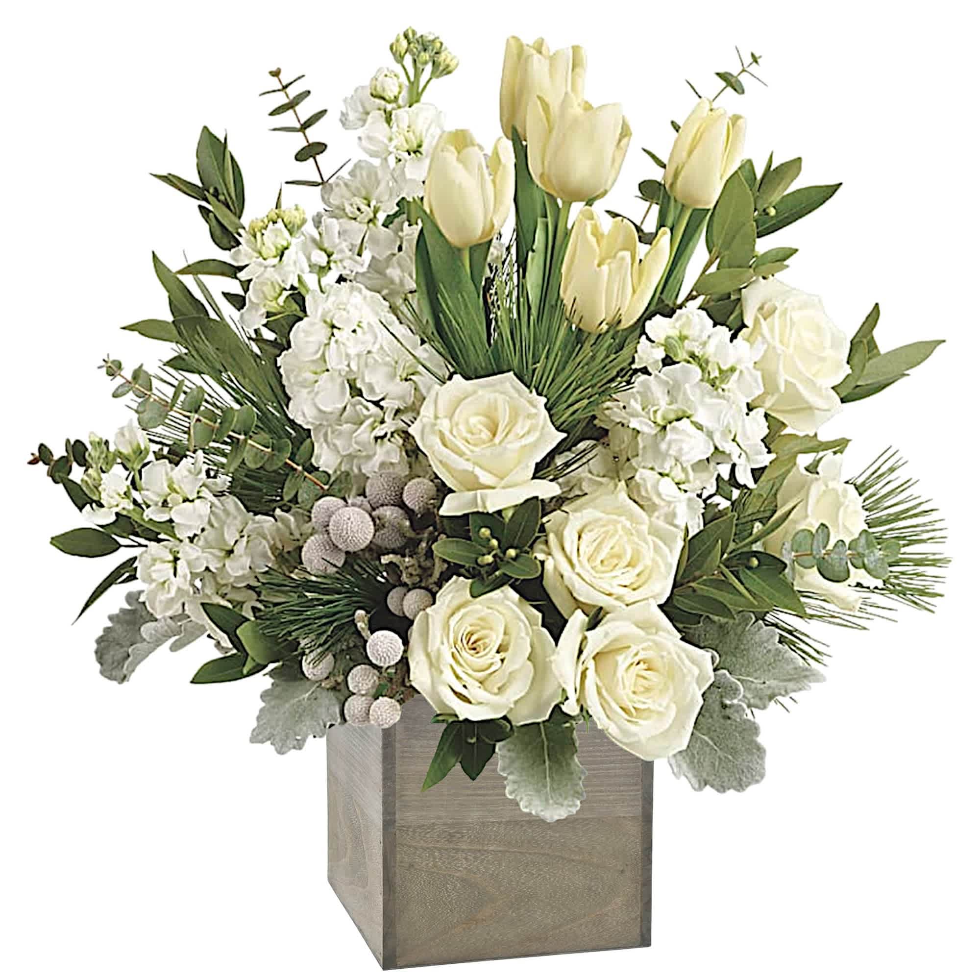 White roses and tulips arranged in a square wooden vase