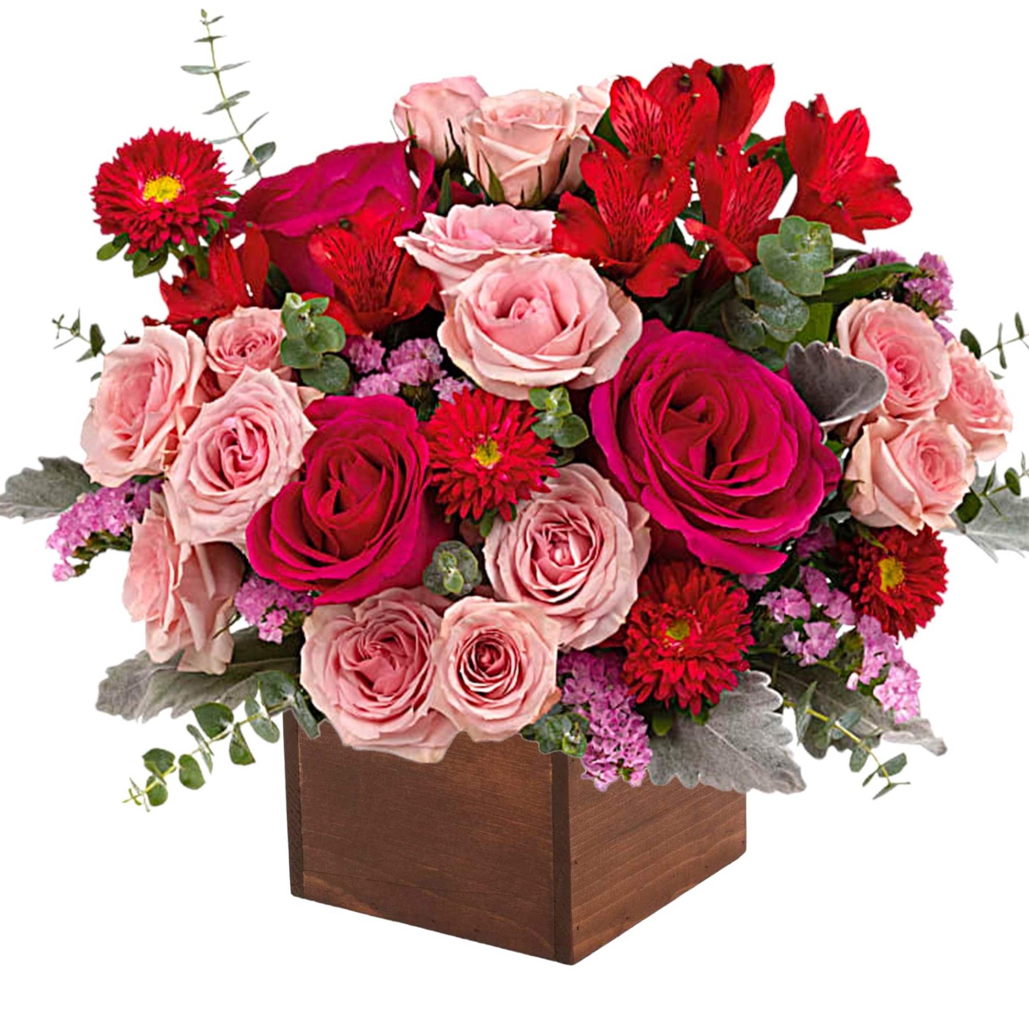Pink and red rose arrangement in a wooden box