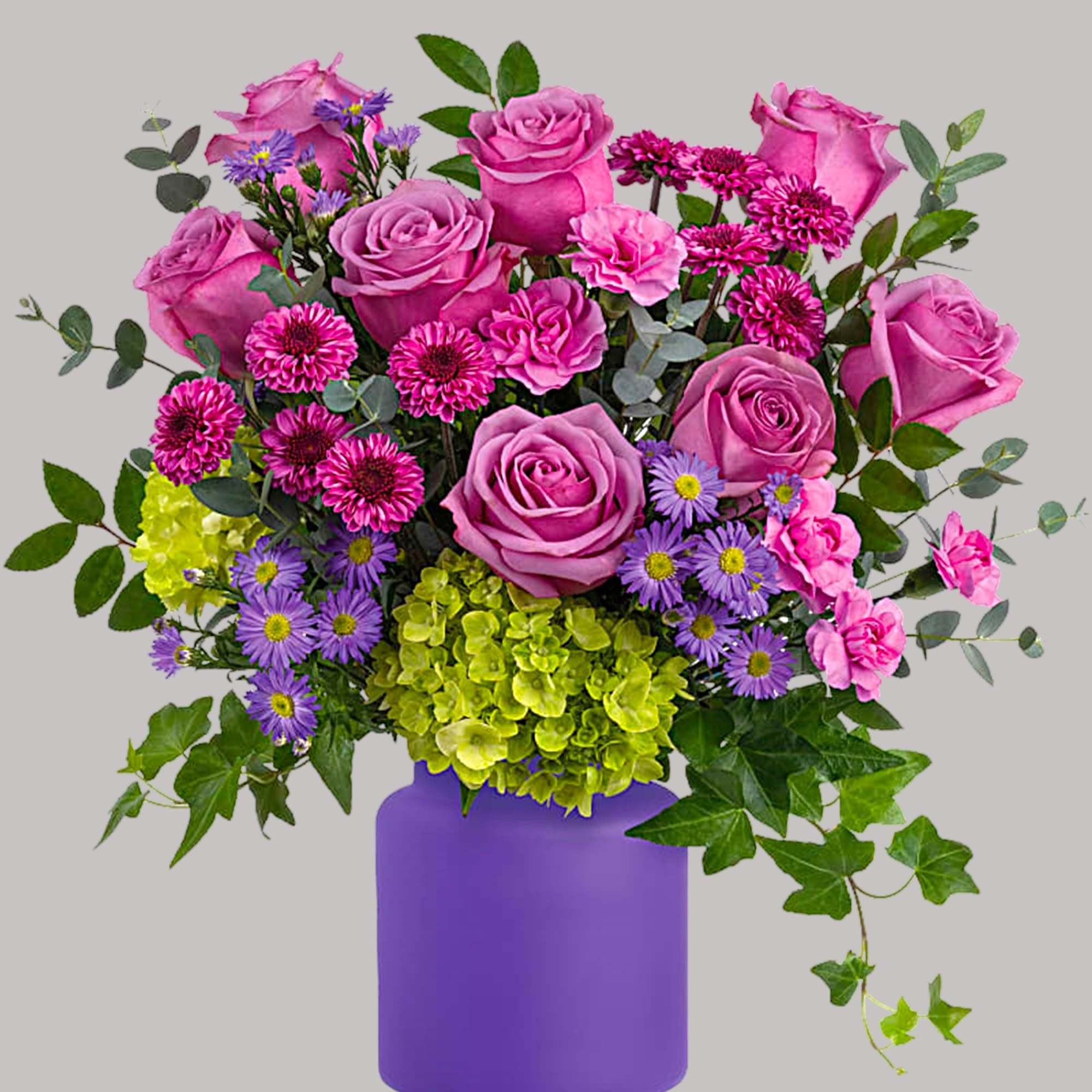 Pink roses and purple flowers in a purple vase, photo 2 of 3