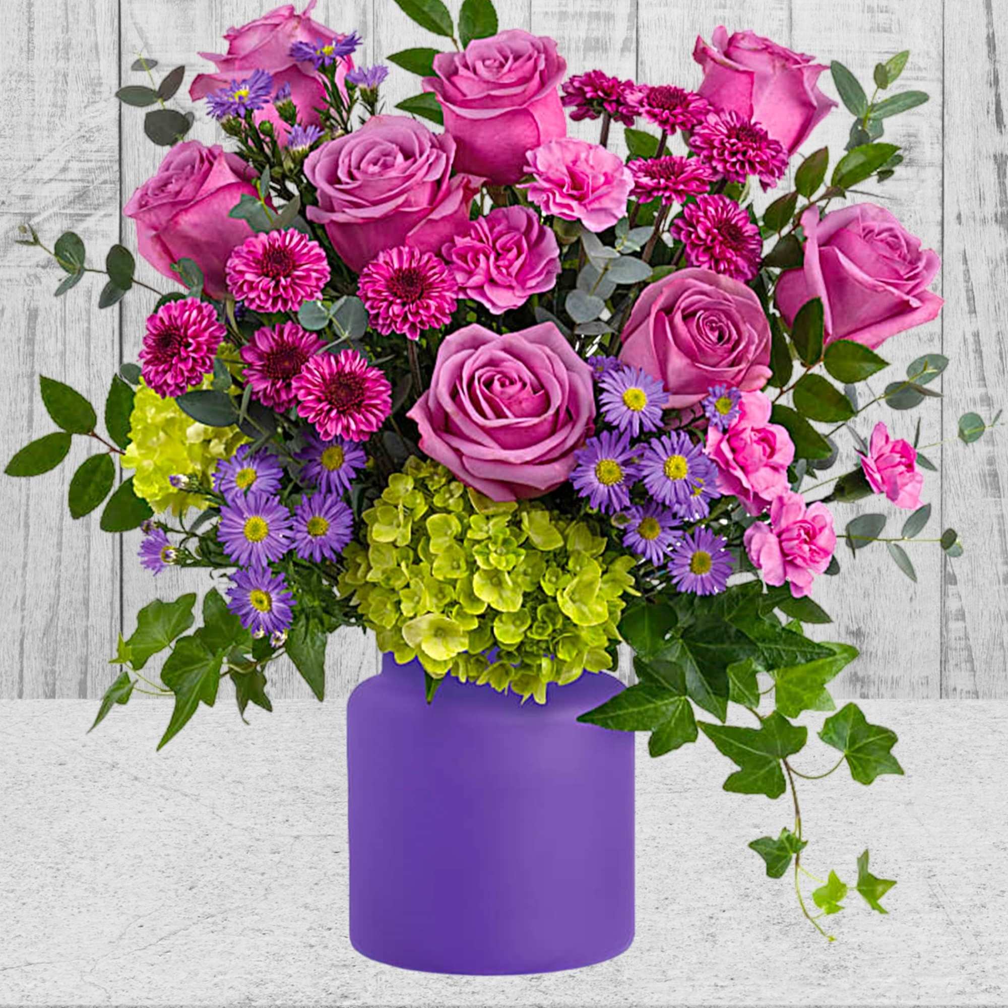 Pink roses and purple flowers in a purple vase, photo 3 of 3
