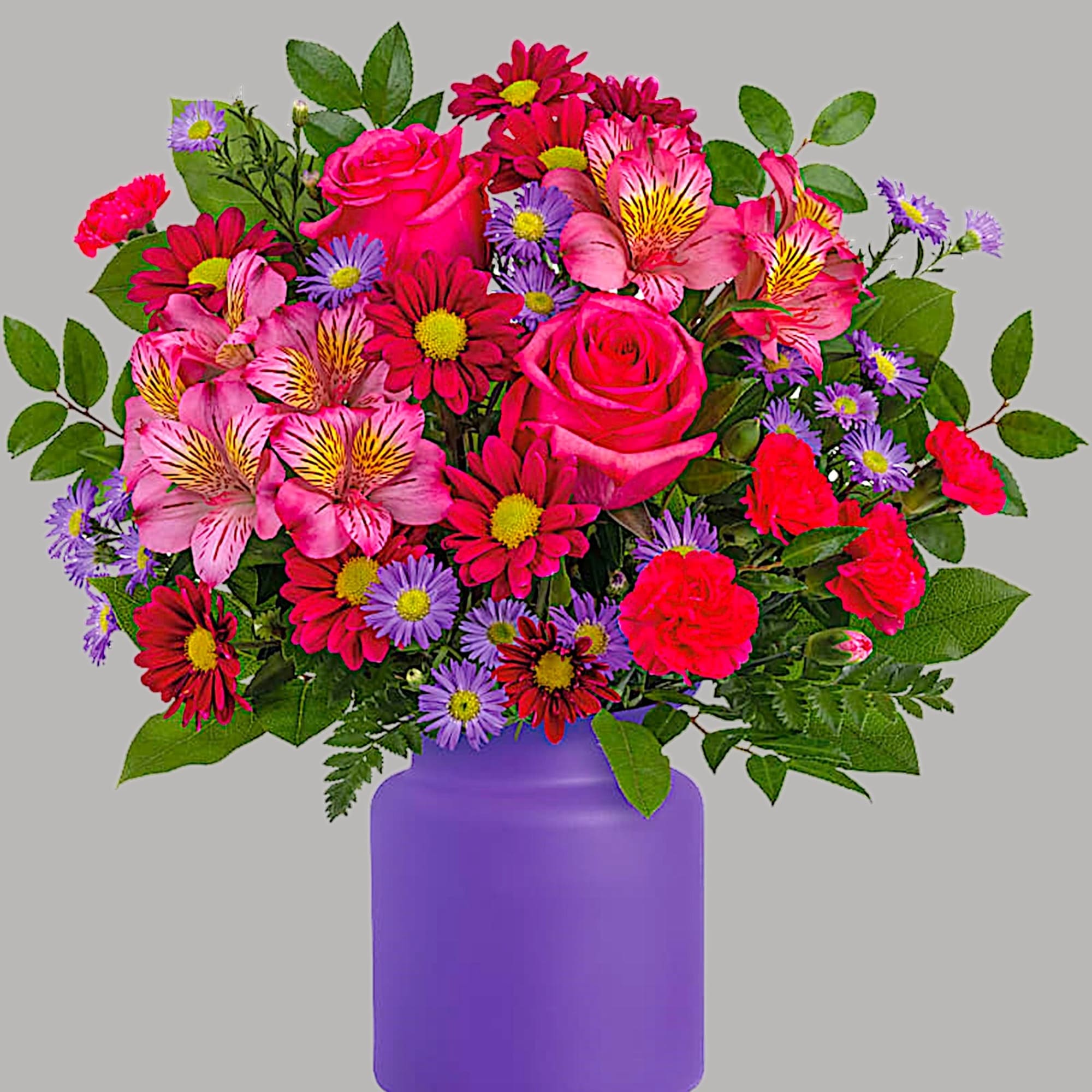Mixed pink and purple flowers in a purple vase, photo 2 of 3