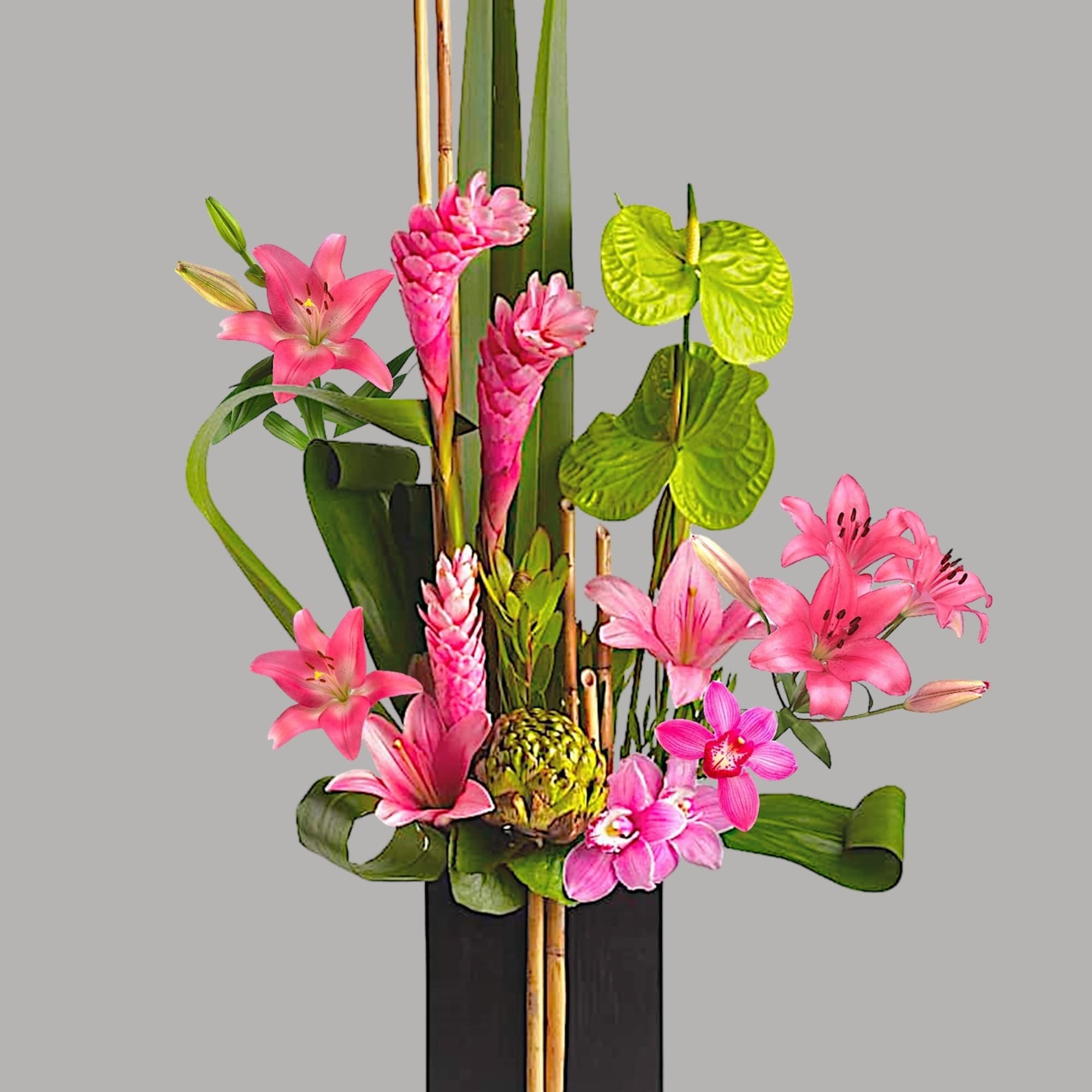 Pink lilies and tropical flowers arranged in a tall black vase