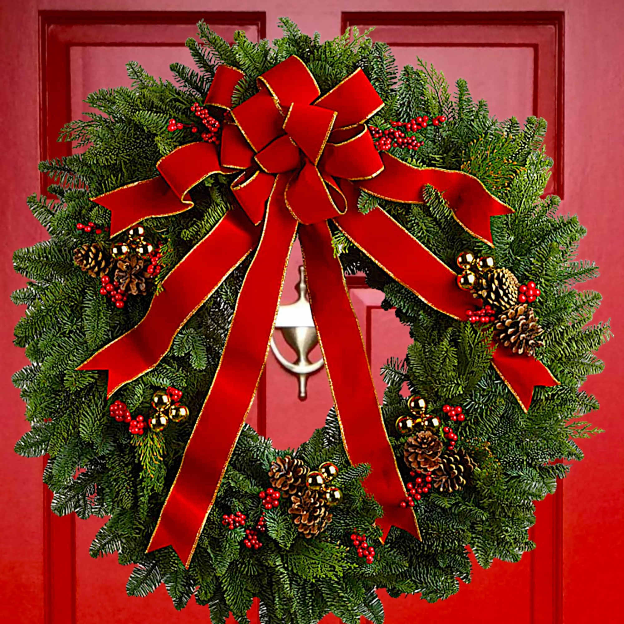 Christmas wreath with a large red bow on a red door