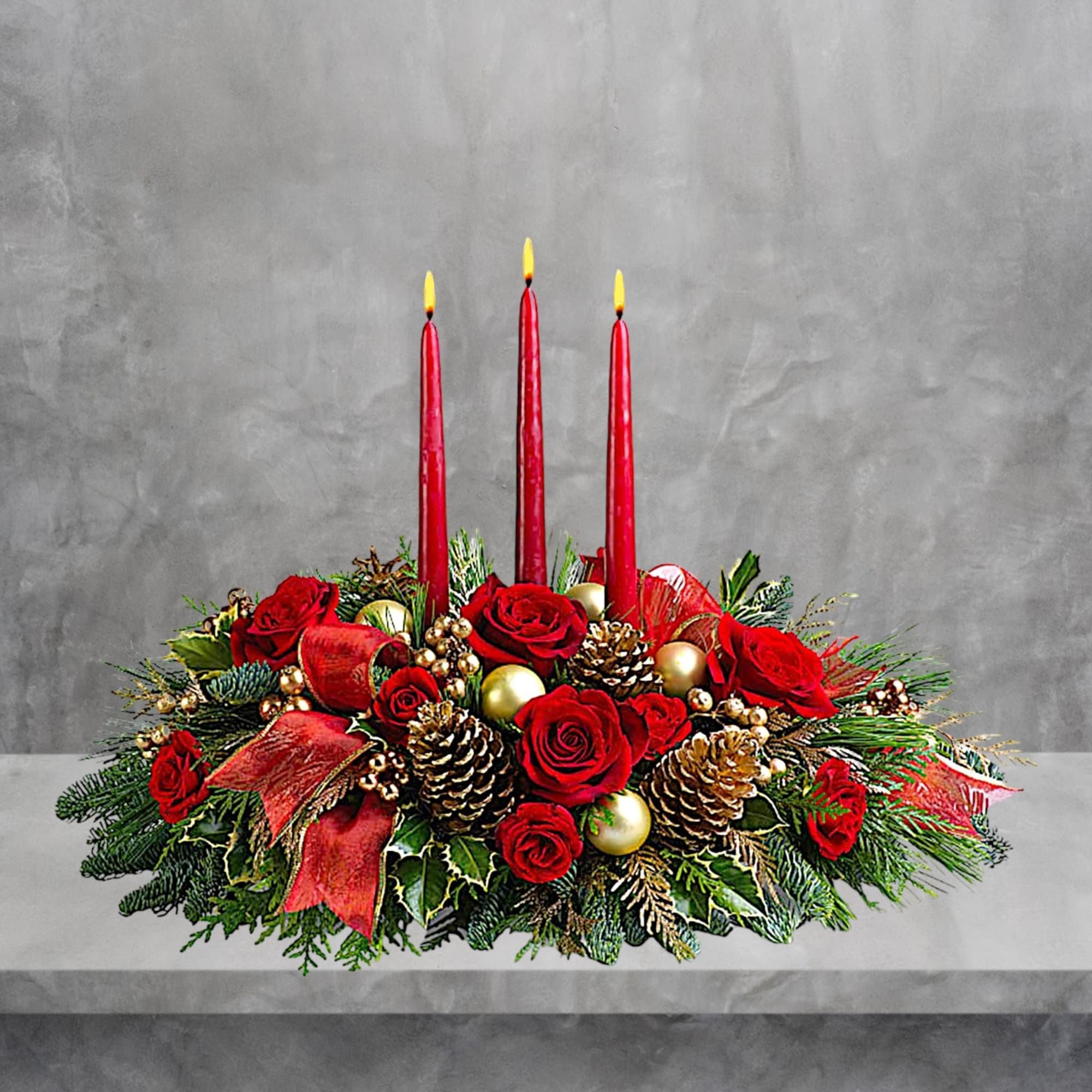 Red rose centerpiece with three red candles and gold ornaments