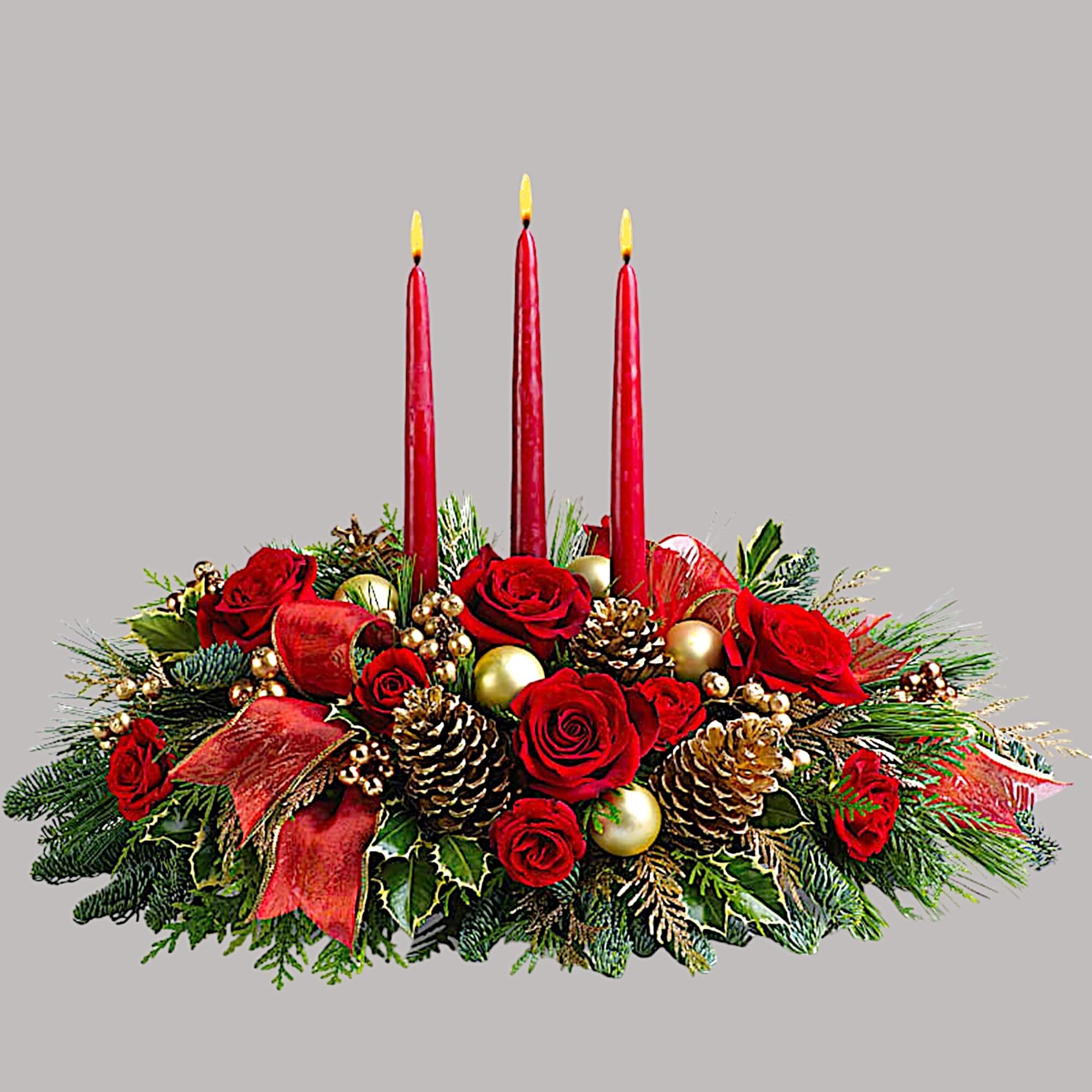 Red rose centerpiece with three lit red candles and gold ornaments