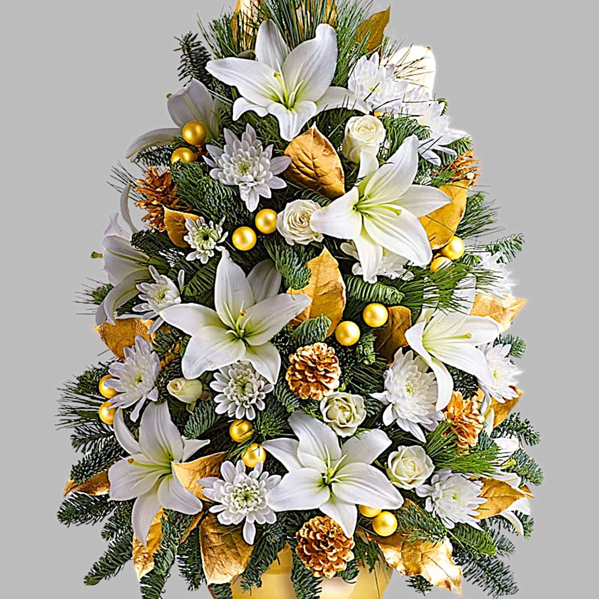 White lilies and chrysanthemums arranged in a gold vase with pinecones and gold accents.
