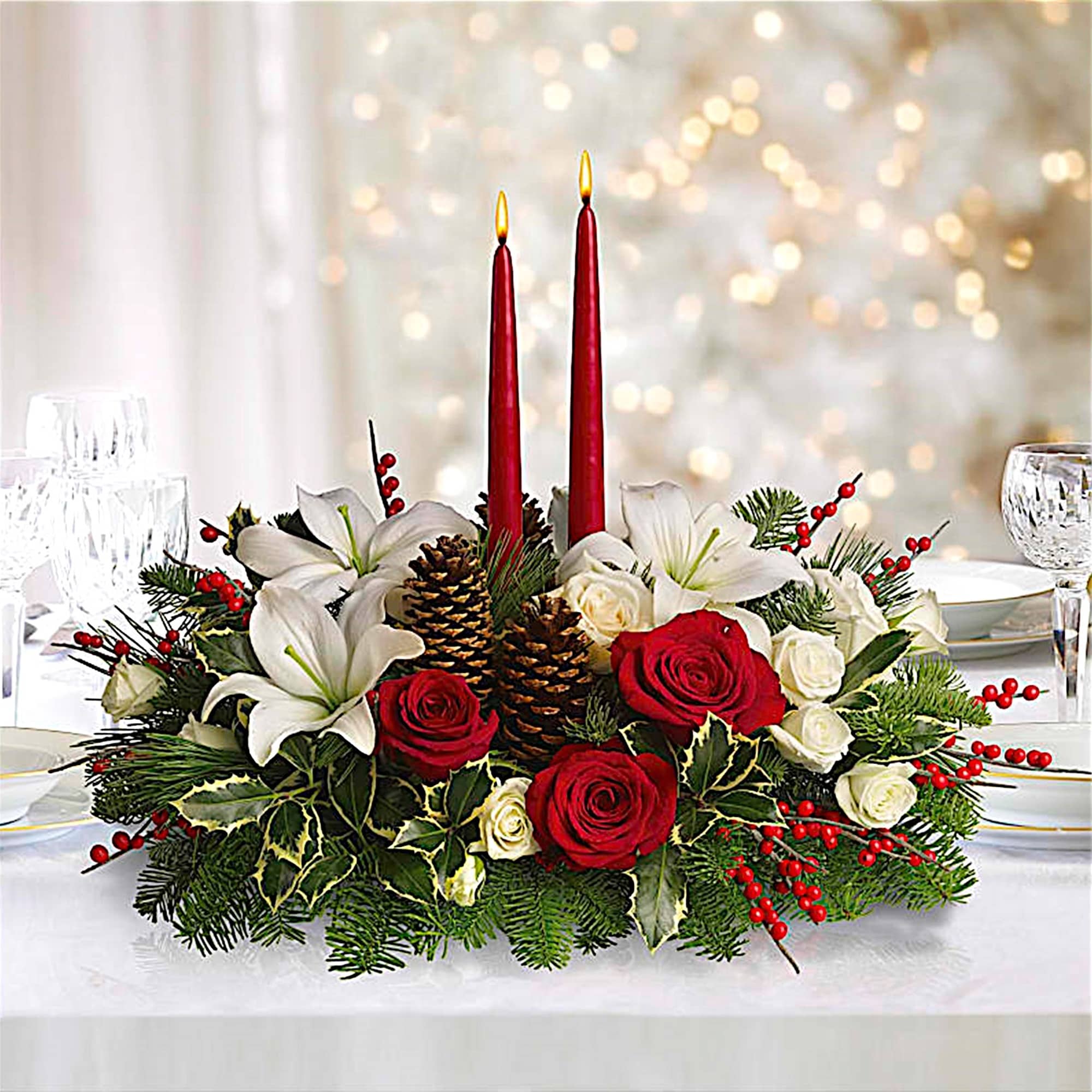 Holiday centerpiece with red candles, roses, lilies, and pinecones, photo 3 of 4