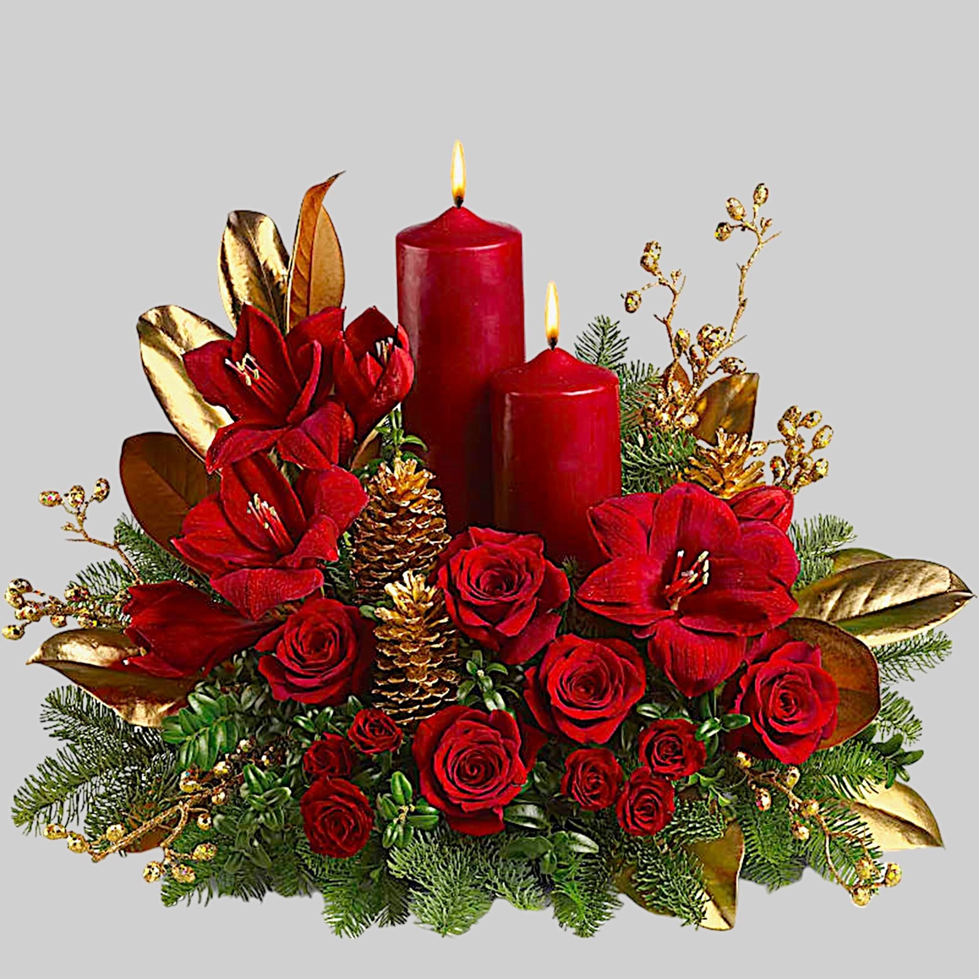 Red roses and amaryllis with two lit red candles