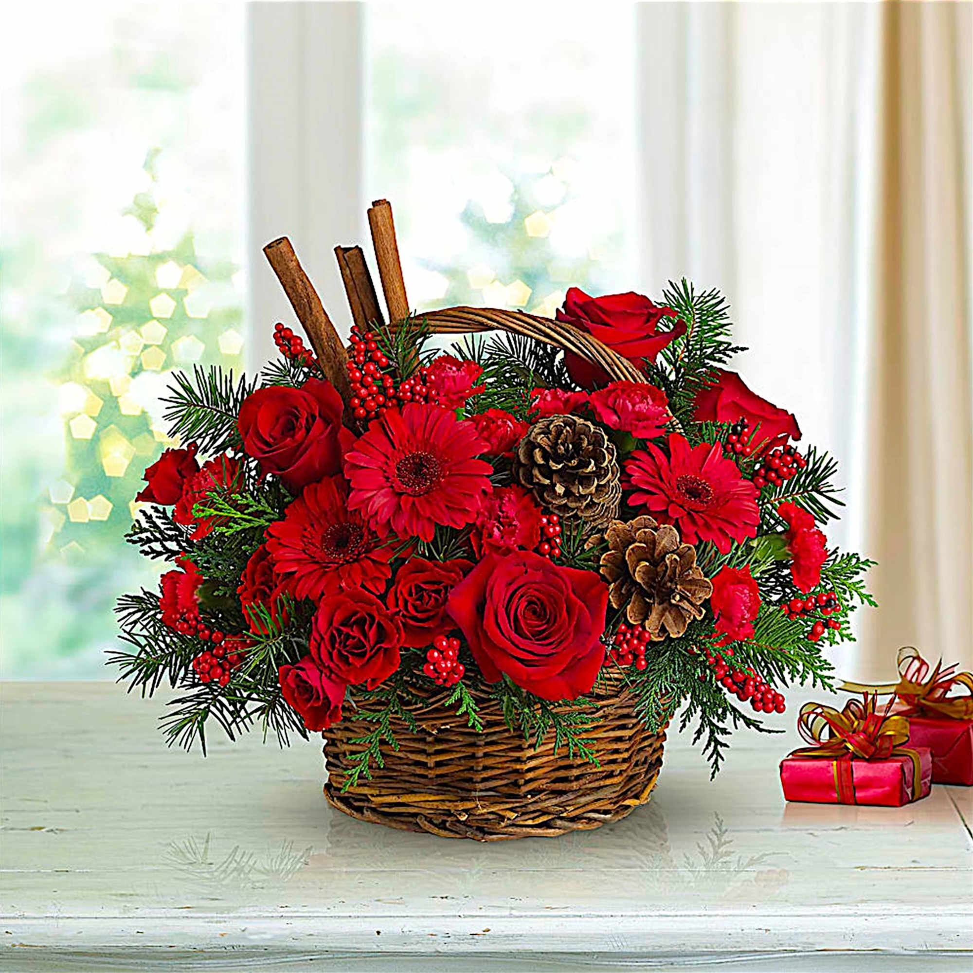 Red roses and gerbera daisies in a wicker basket with pinecones, photo 3 of 4