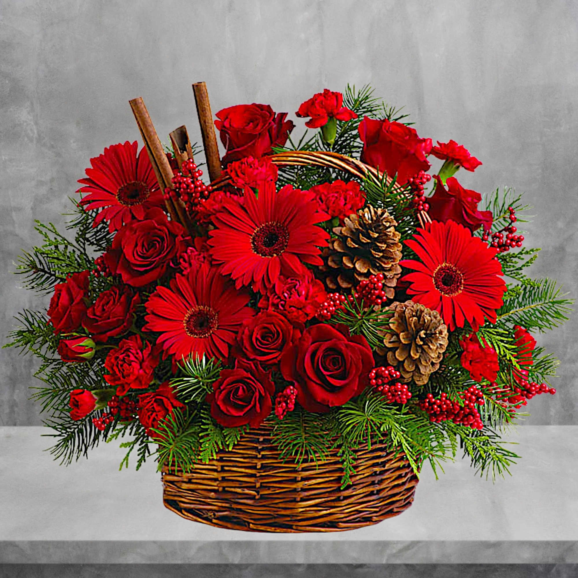 Red roses and gerbera daisies in a wicker basket with pinecones, photo 2 of 4