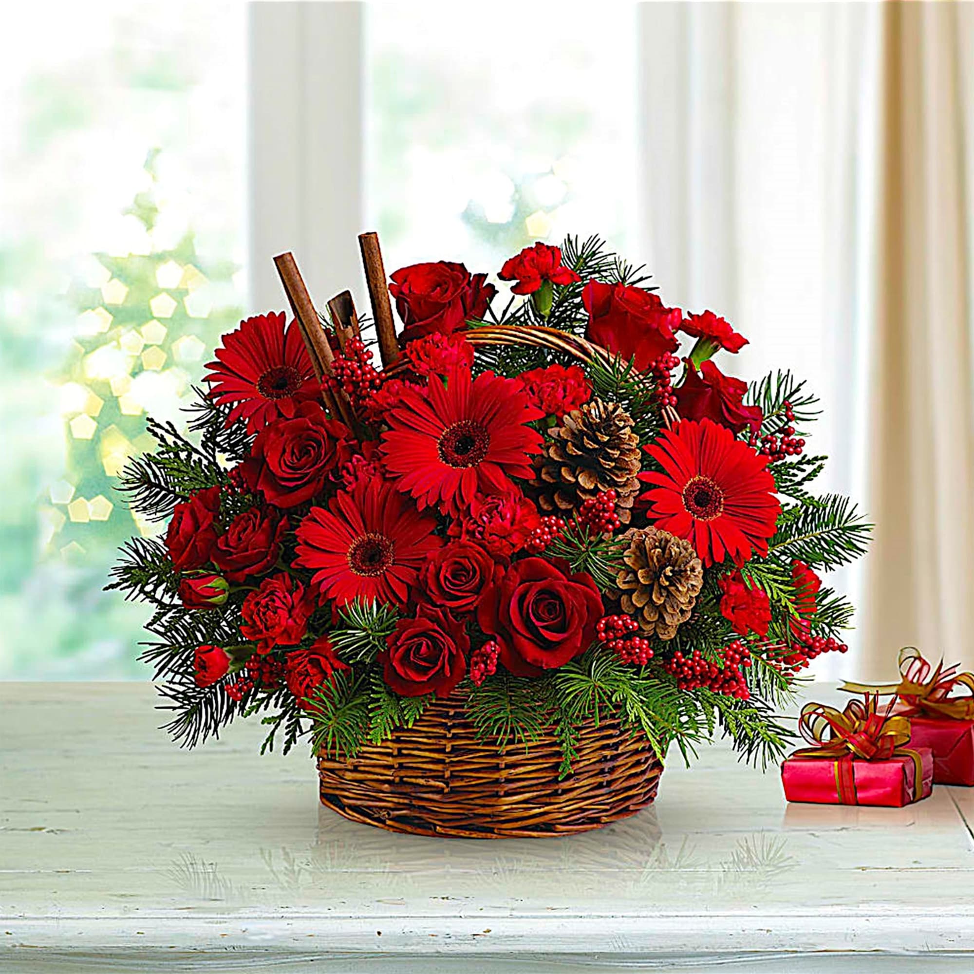 Red roses and gerbera daisies in a wicker basket with pinecones, photo 3 of 4