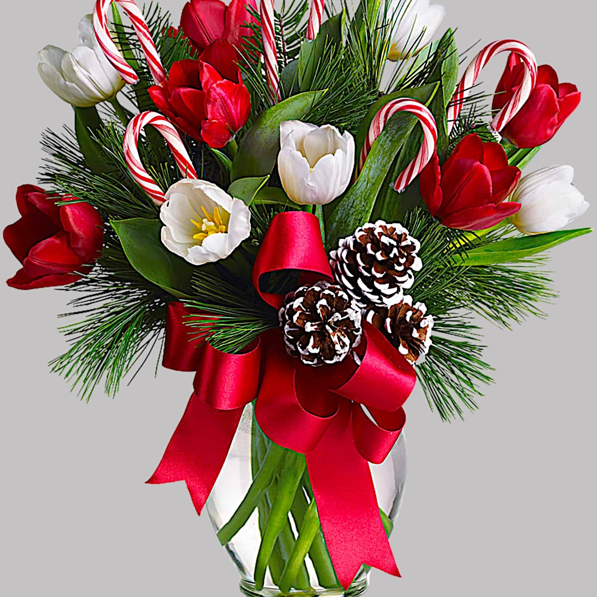 Red and white tulips with candy canes in a glass vase, photo 4 of 4