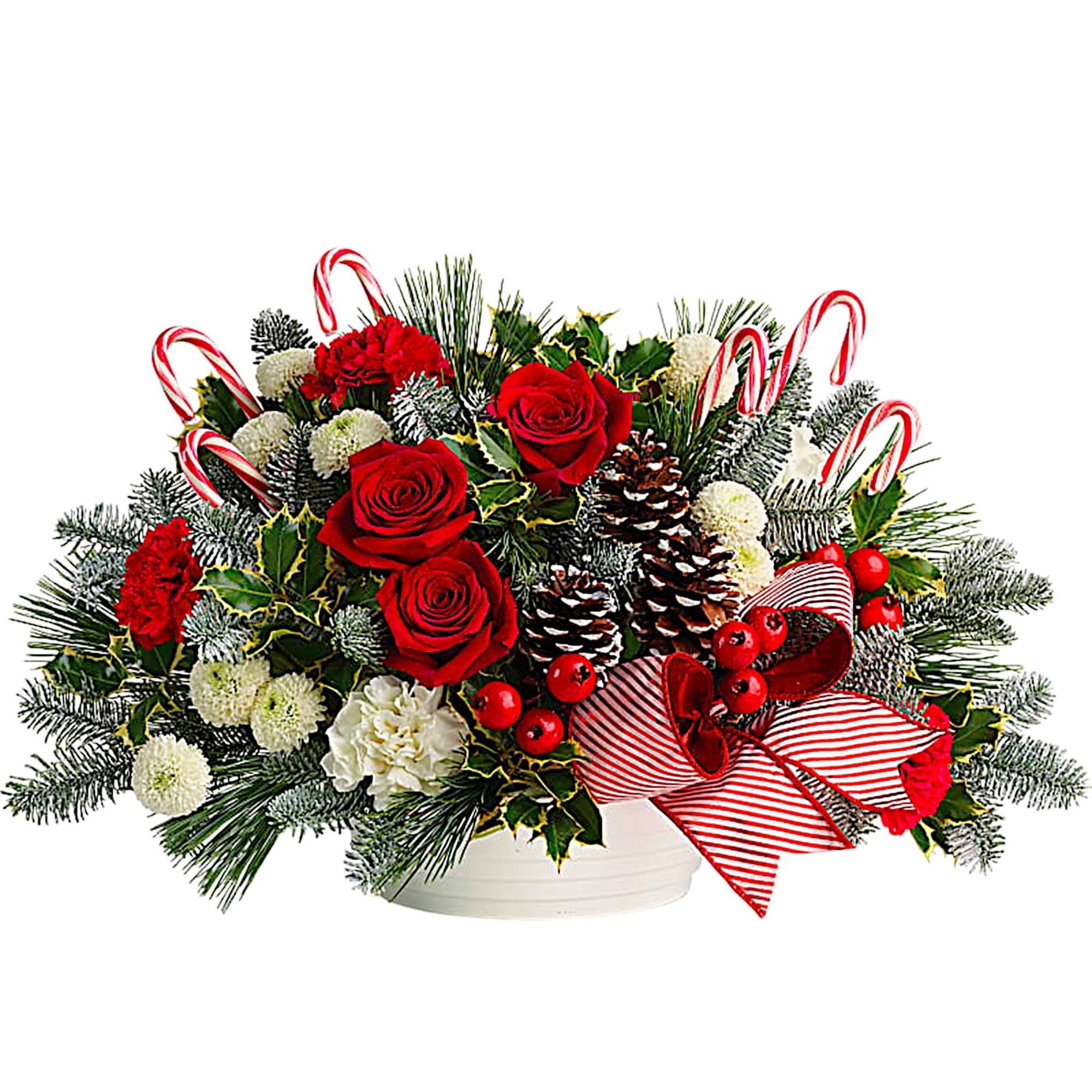 Christmas bouquet with red roses, carnations, pinecones, and candy canes in a white container