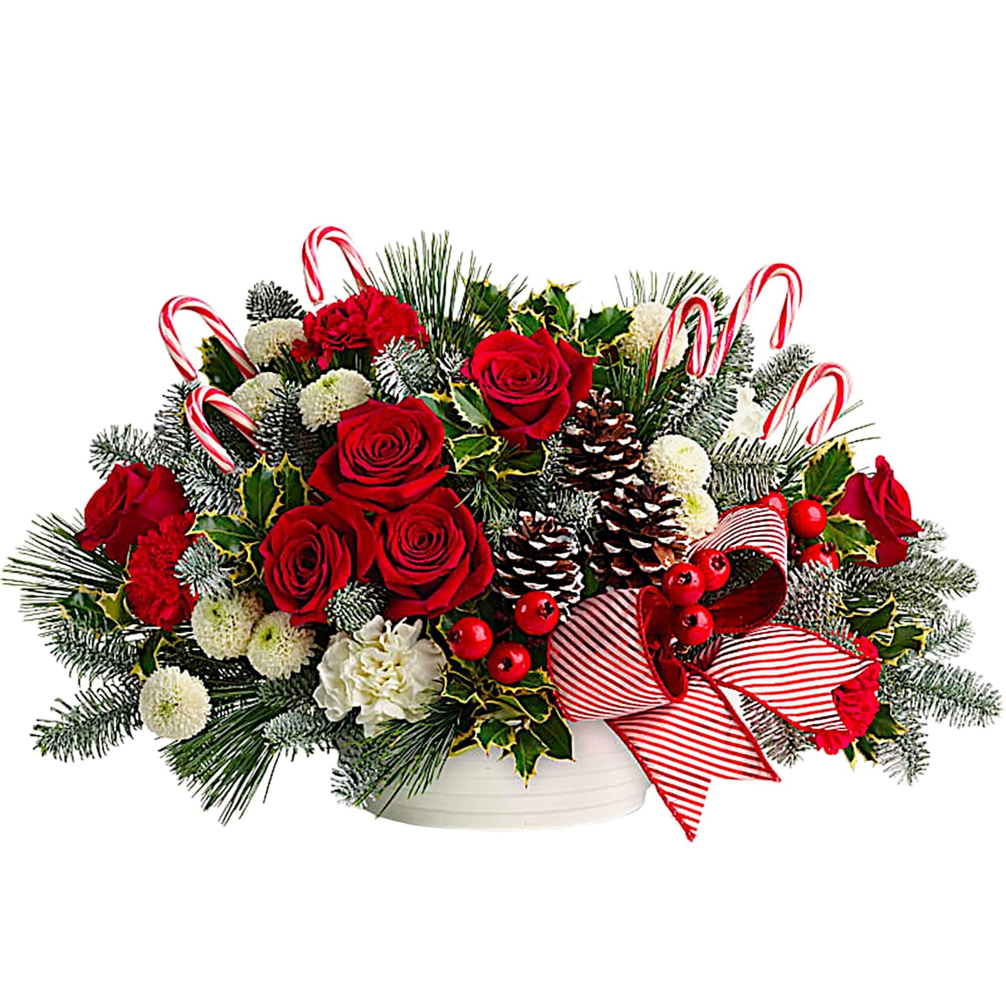 Christmas arrangement with red roses, candy canes, and pinecones in a white container