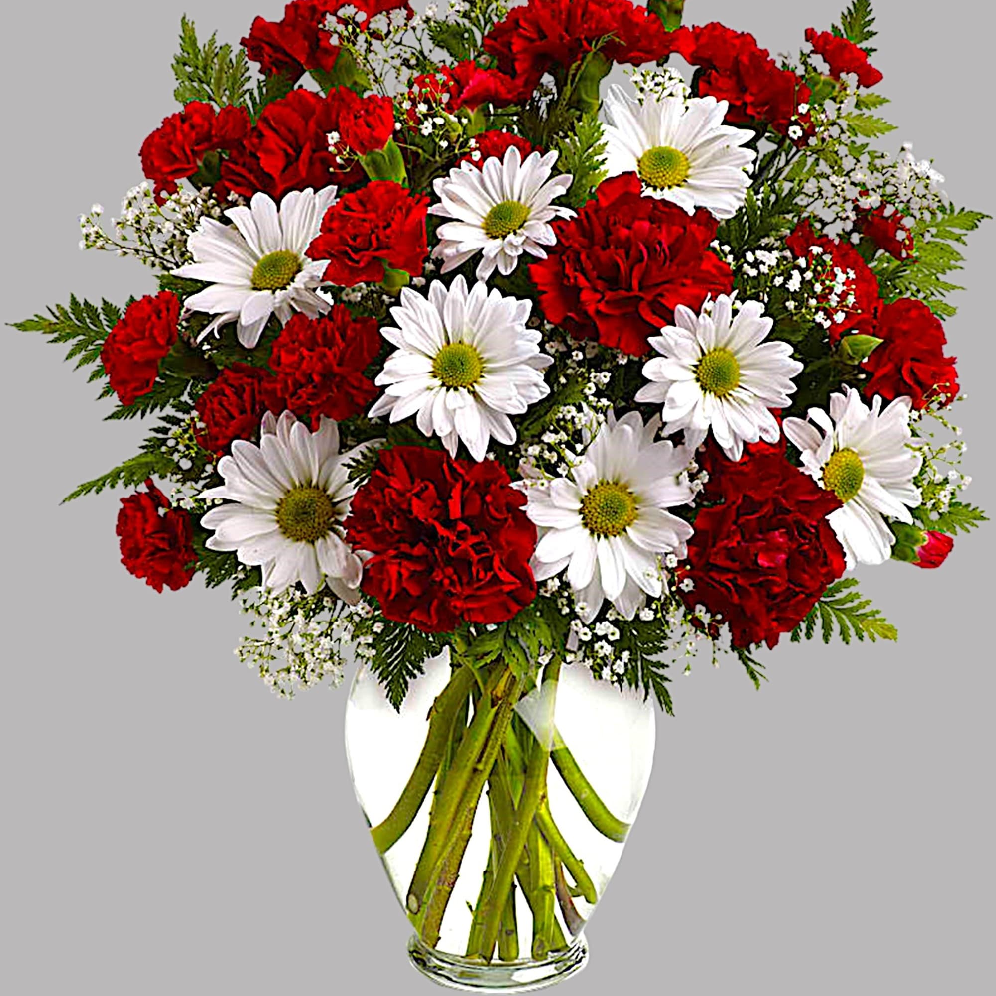 Red carnations and white daisies in a clear glass vase, photo 3 of 3