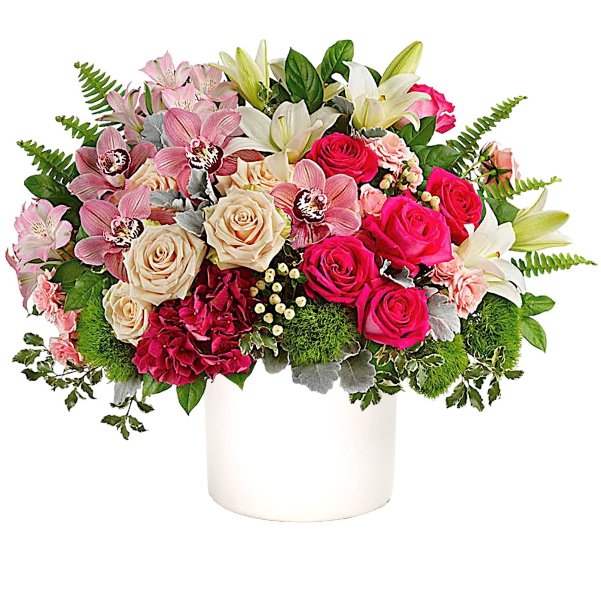 Mixed bouquet of pink and white flowers in a white vase