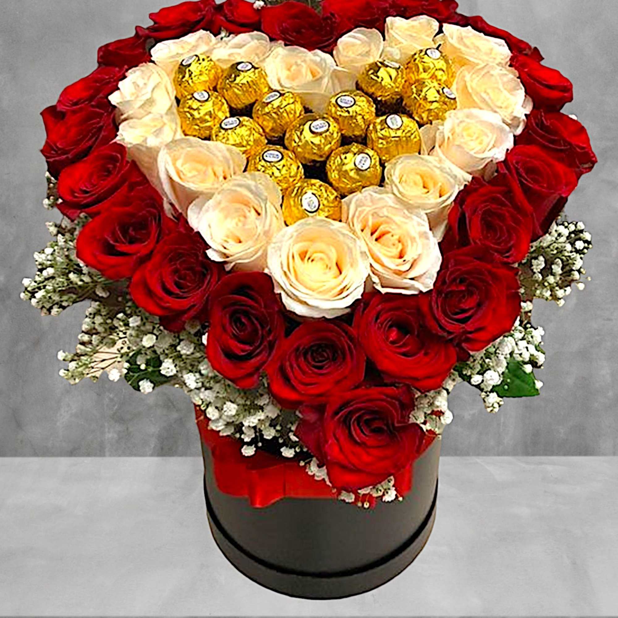 Heart-shaped rose arrangement with gold-wrapped chocolates in a black box, photo 2 of 4