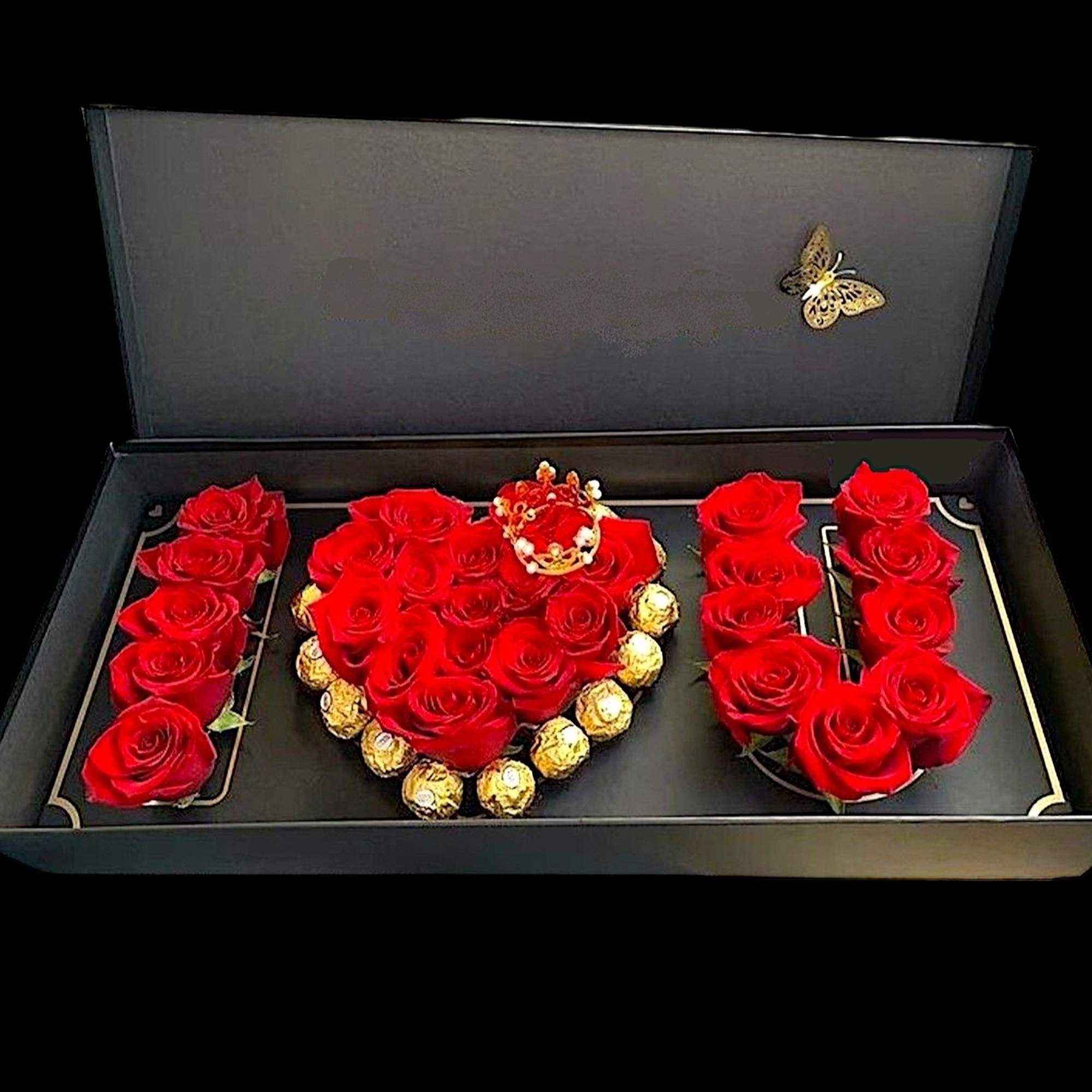 Red roses arranged in a gift box spelling "I ♥ U" with chocolates