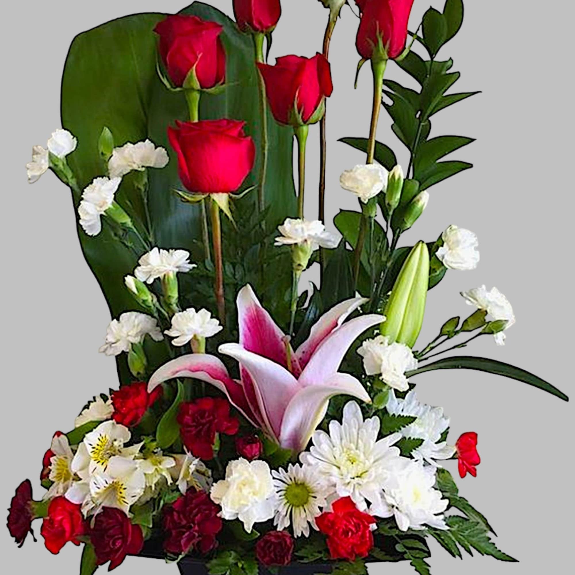 Tall floral arrangement with red roses, white lilies, and white daisies in a black container