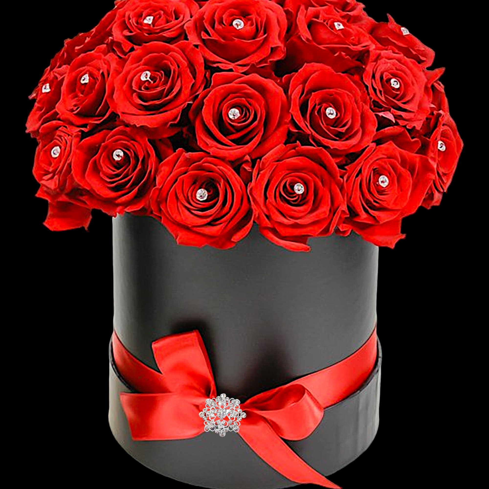 Red roses arranged in a black hat box with a red ribbon