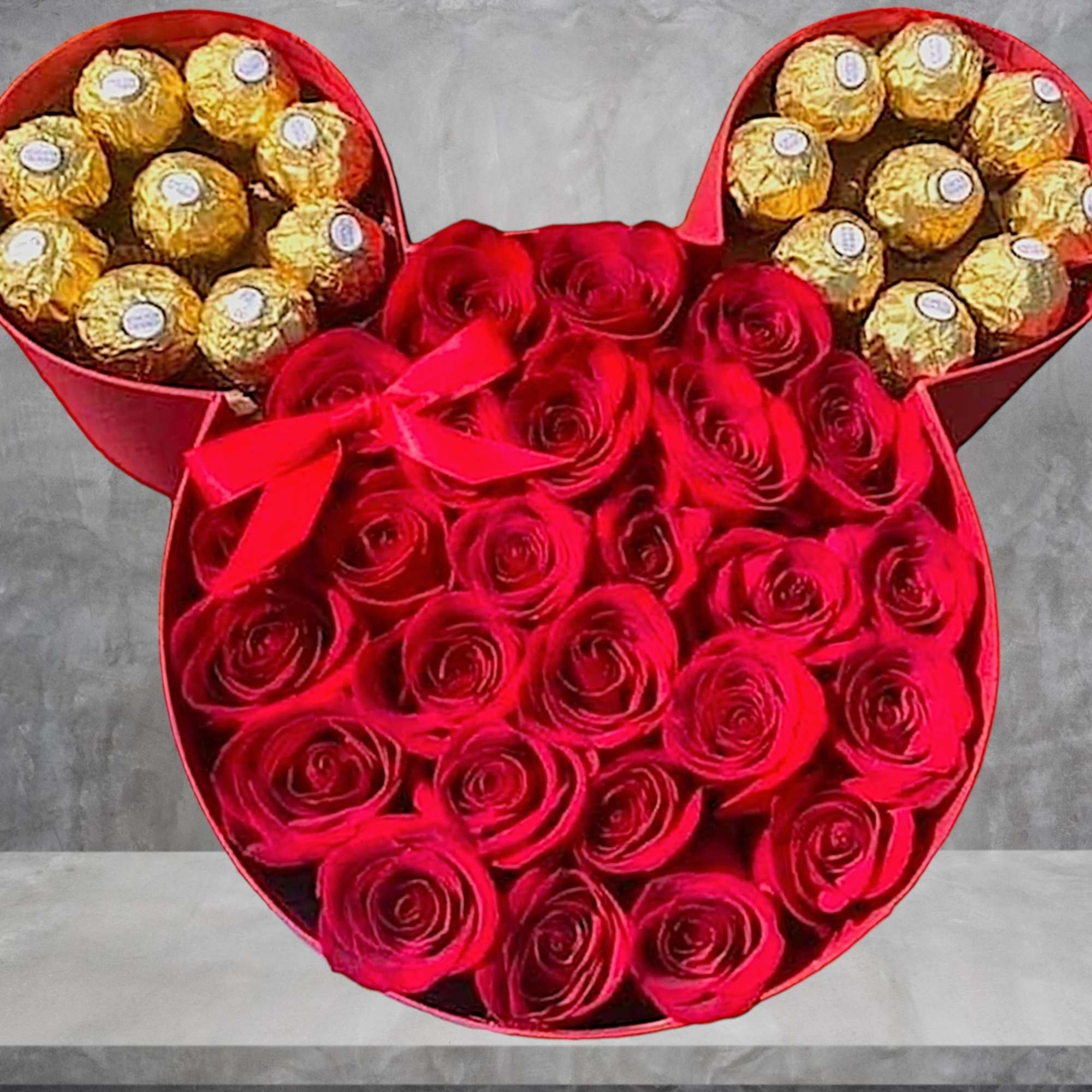 Red rose arrangement with Ferrero Rocher chocolates in a Mickey-shaped box