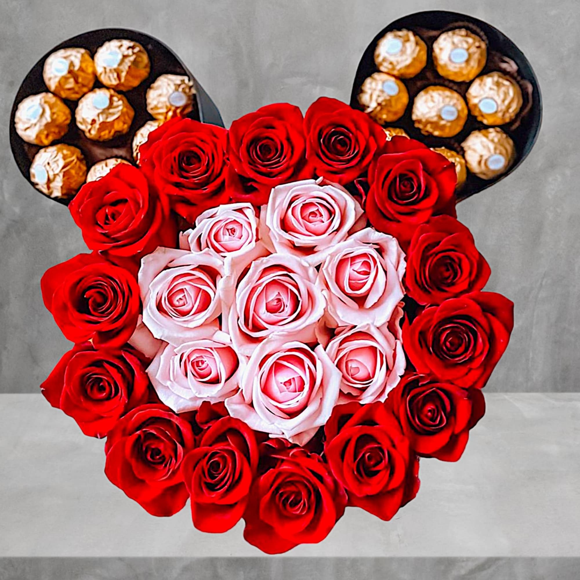 Heart-shaped rose arrangement with Ferrero Rocher chocolates in black containers