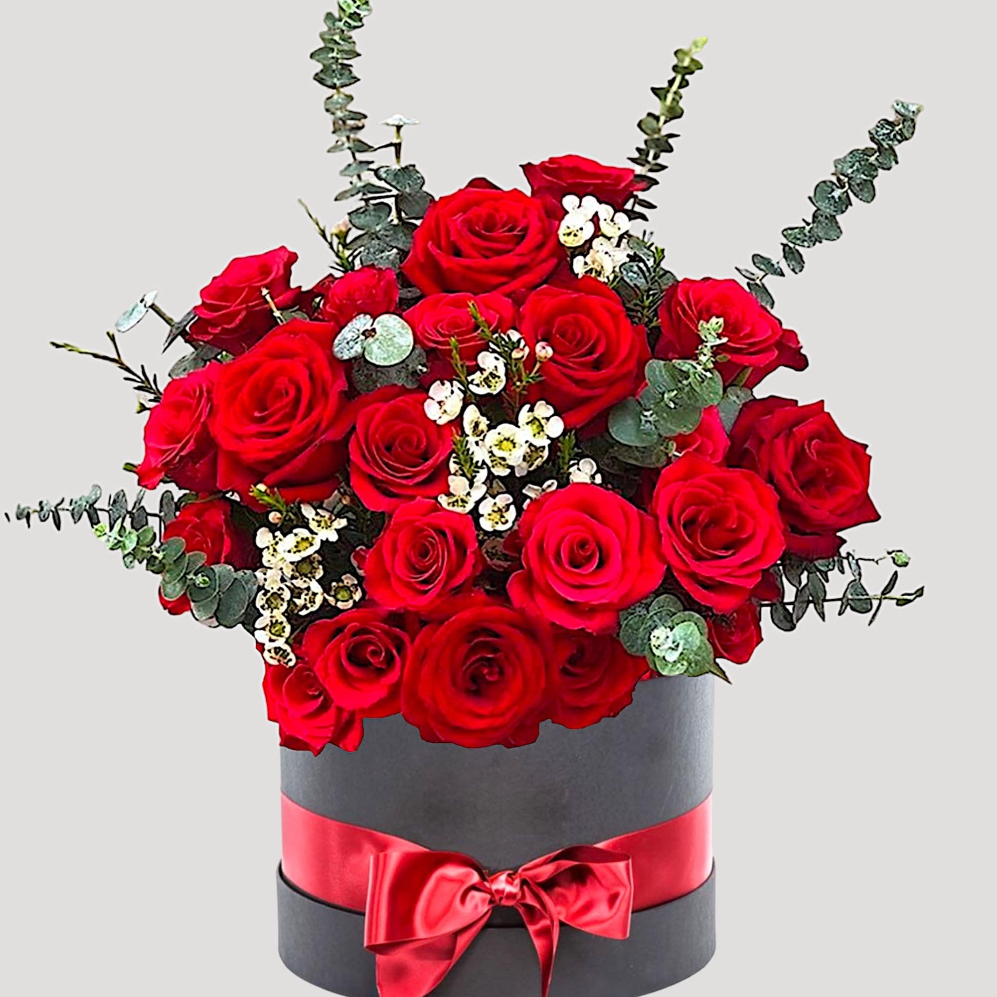 Red roses arranged in a black hatbox with a red ribbon, photo 4 of 4