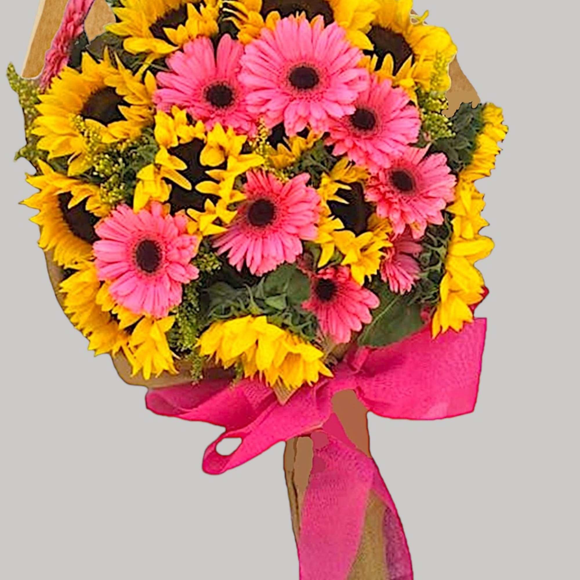 Bouquet of pink gerbera daisies and yellow sunflowers tied with a bright pink ribbon