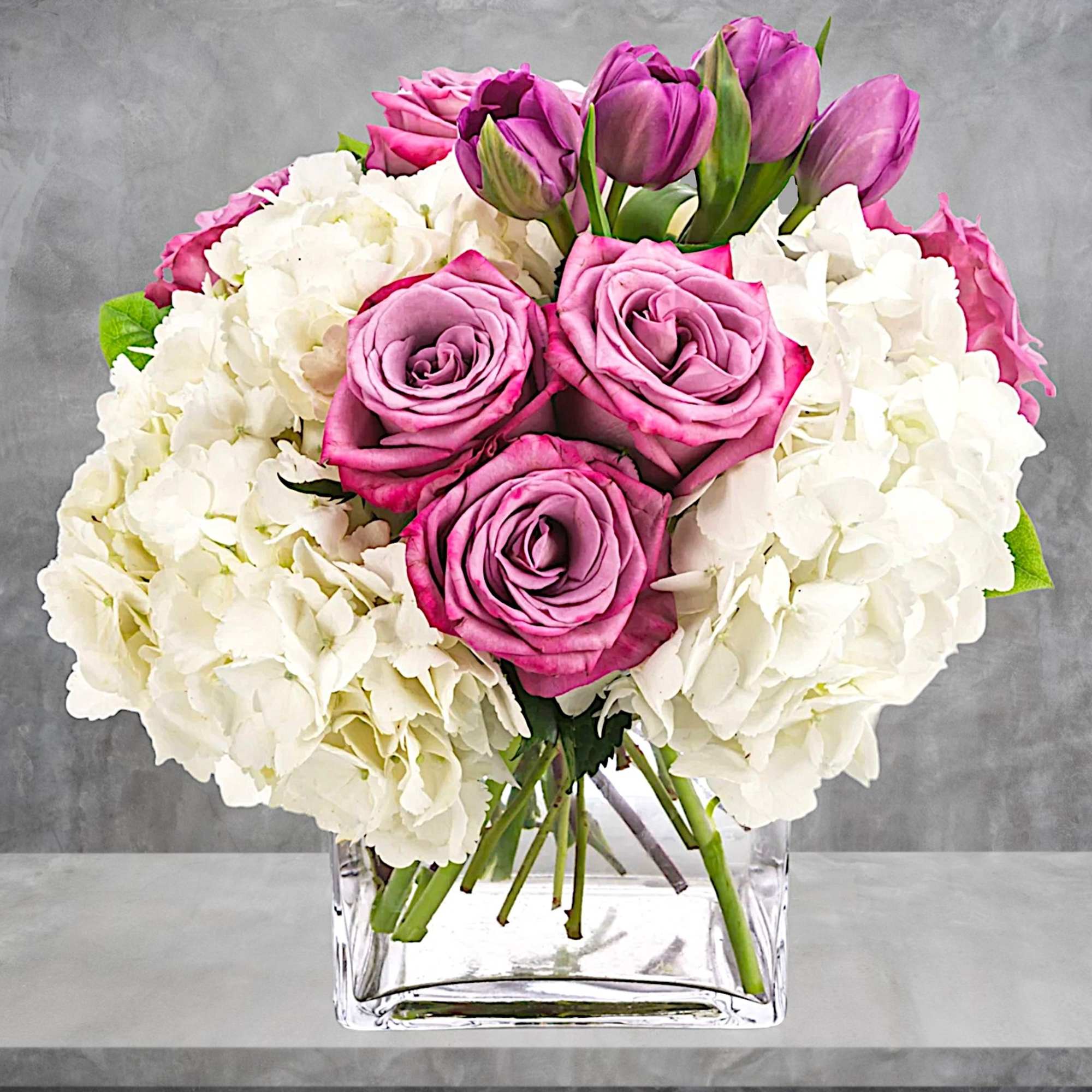 Express your feelings with flowers. Sending this lovely purple and white arrangement, photo 2 of 4