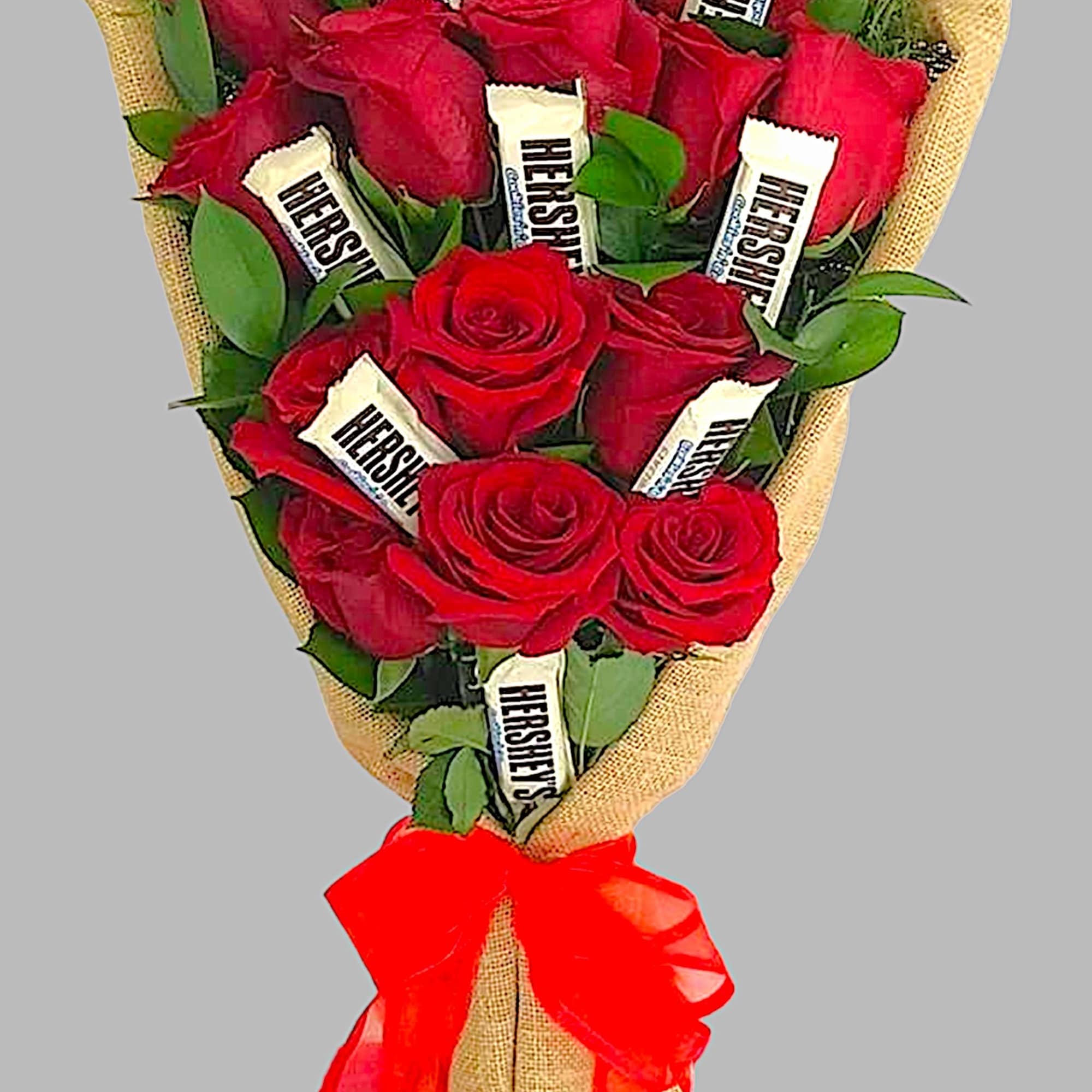 Bouquet of red roses with Hershey's chocolates wrapped in burlap and tied with a red bow
