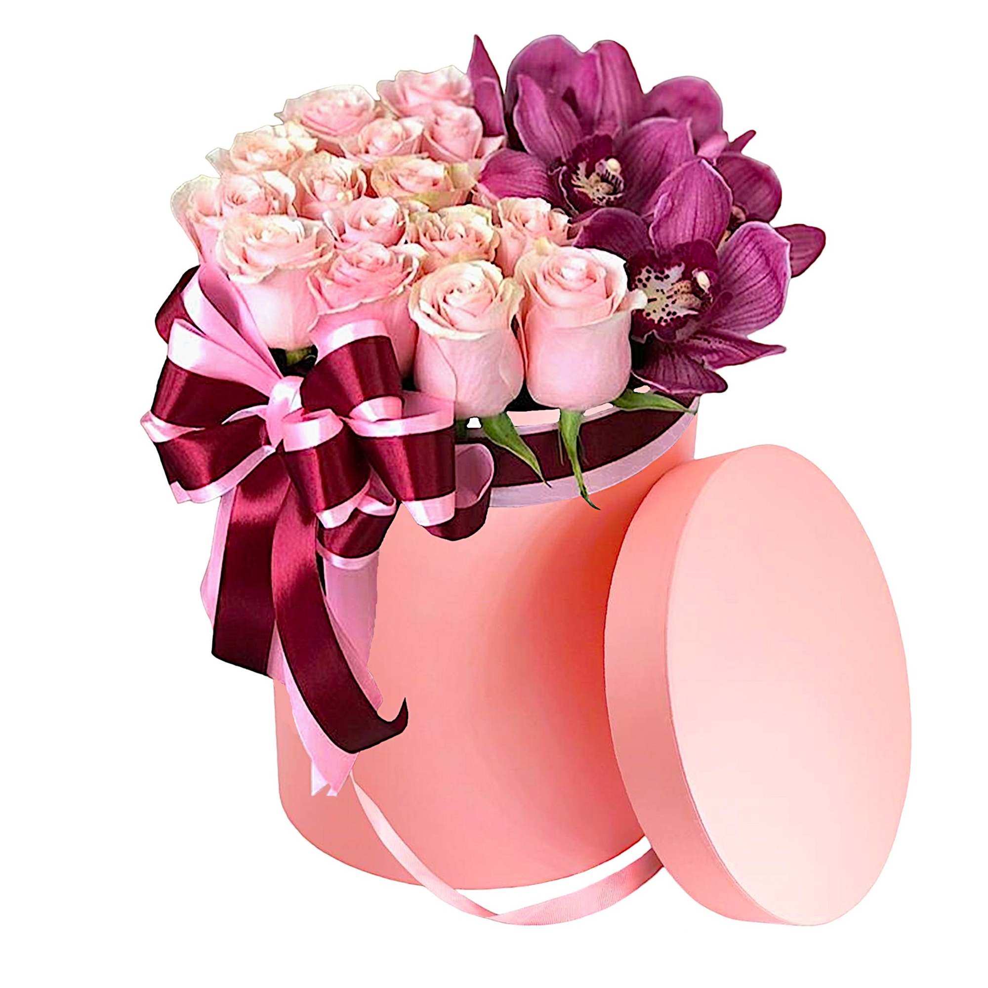 Pink roses and purple orchids in a round pink box with ribbon