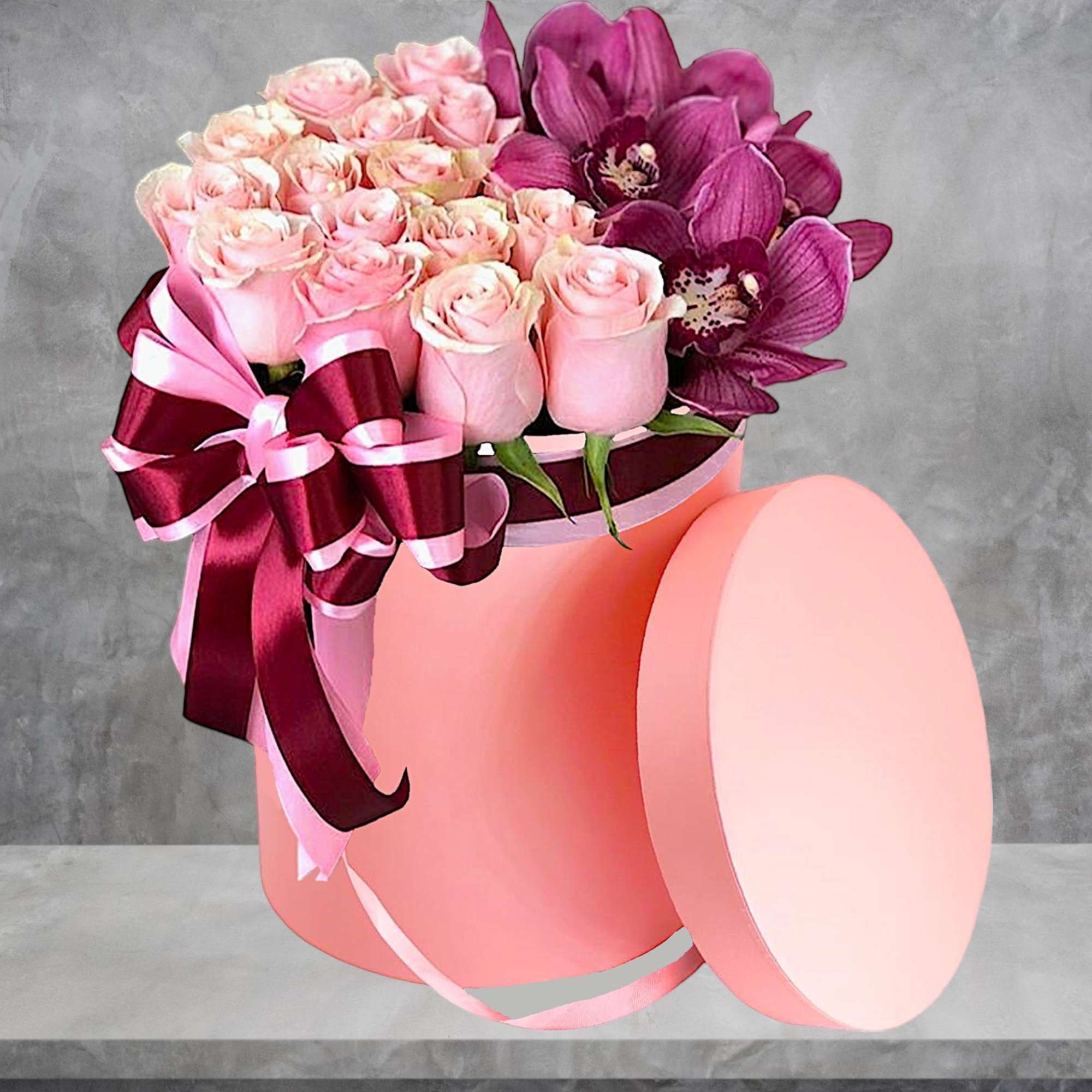 Pink roses and purple orchids in a round pink box with ribbon, photo 2 of 4