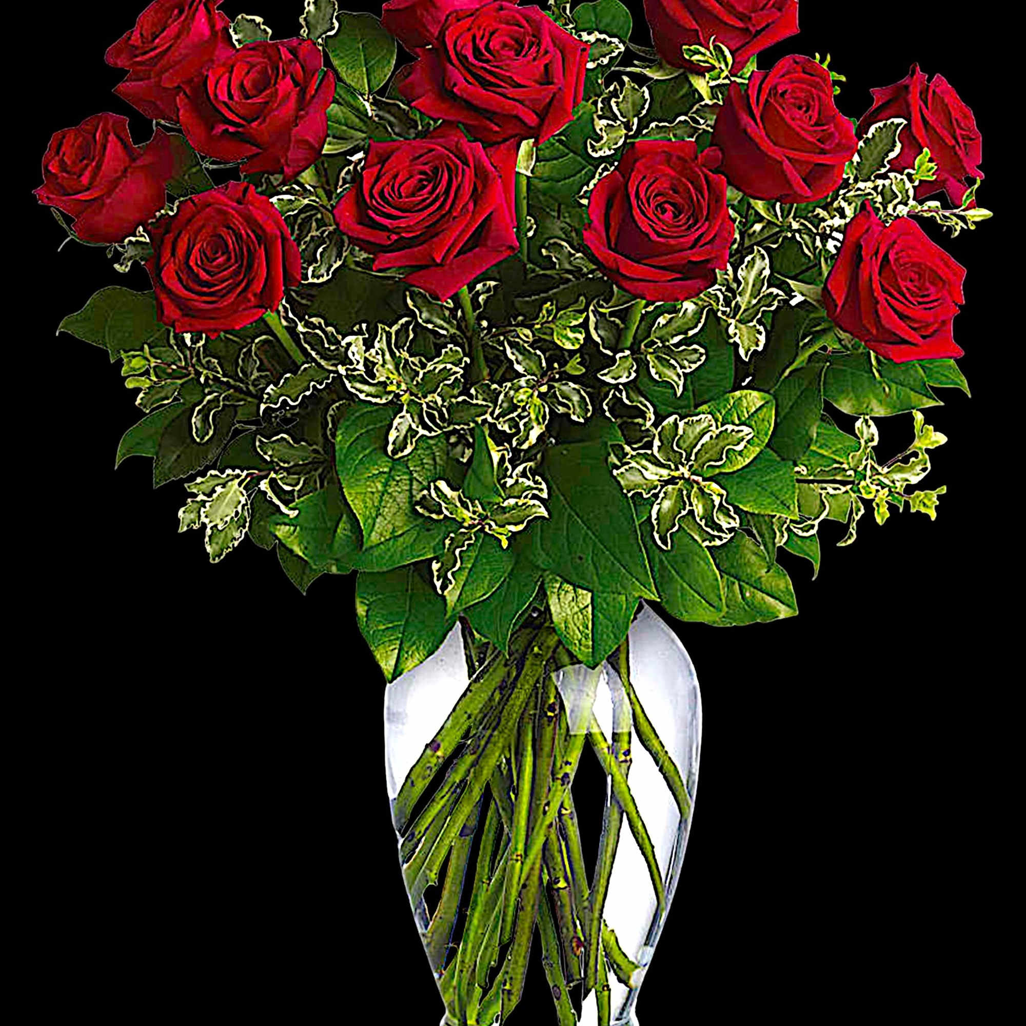 Red roses arranged in a clear glass vase with variegated greenery, photo 5 of 6