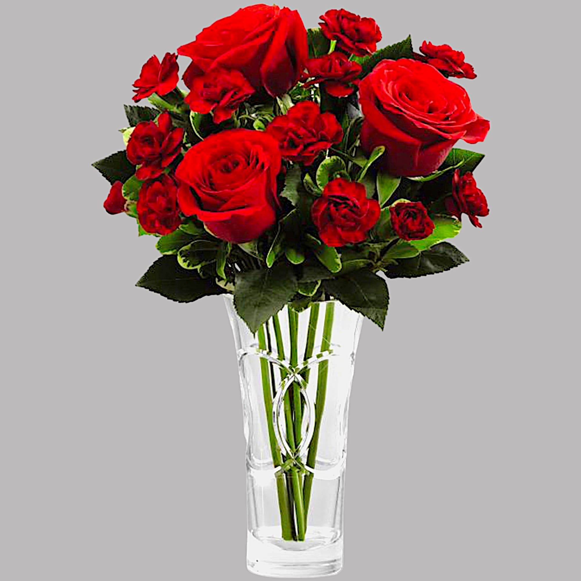 Red roses arranged in a clear glass vase, photo 7 of 8