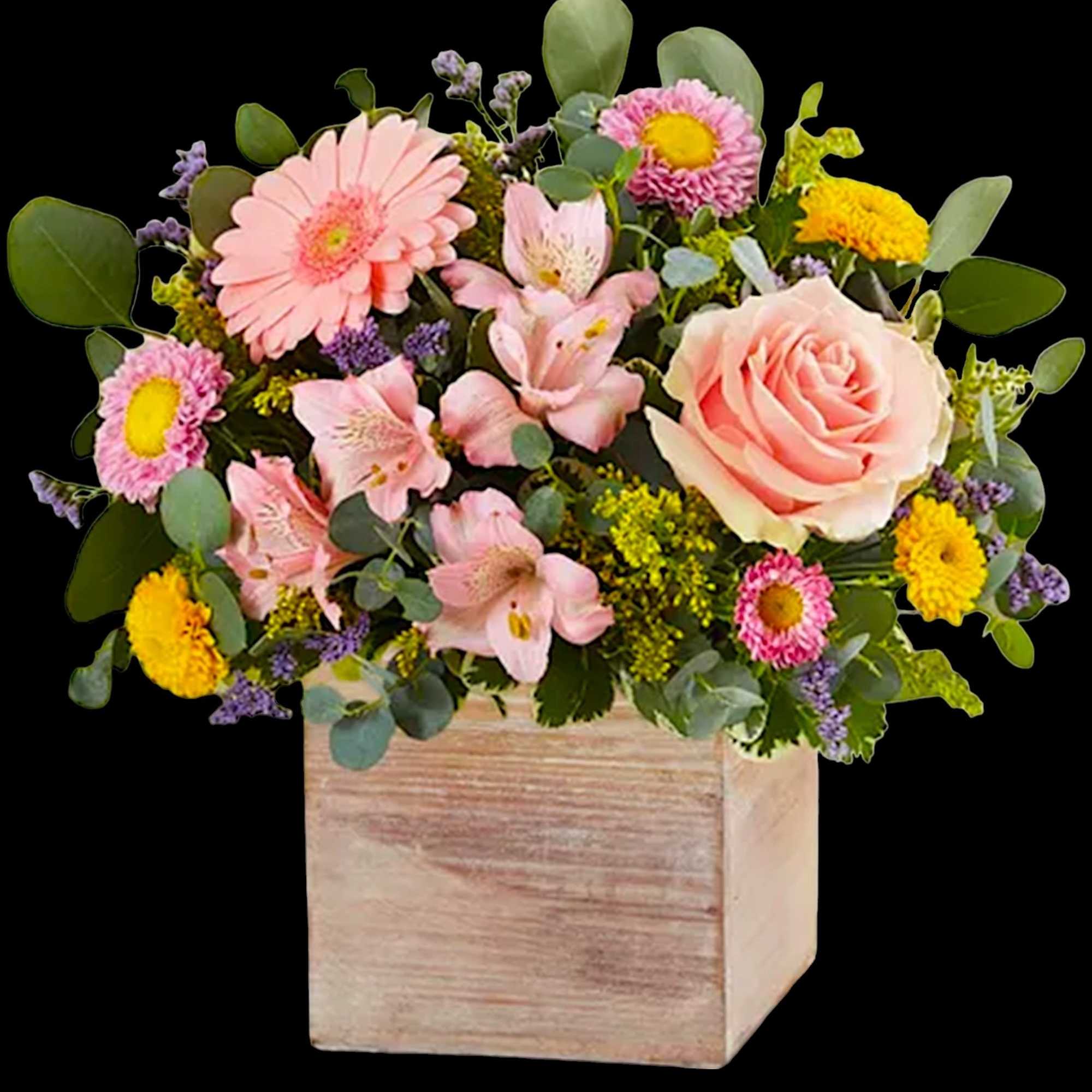 Pink and yellow mixed flower arrangement in a wooden box