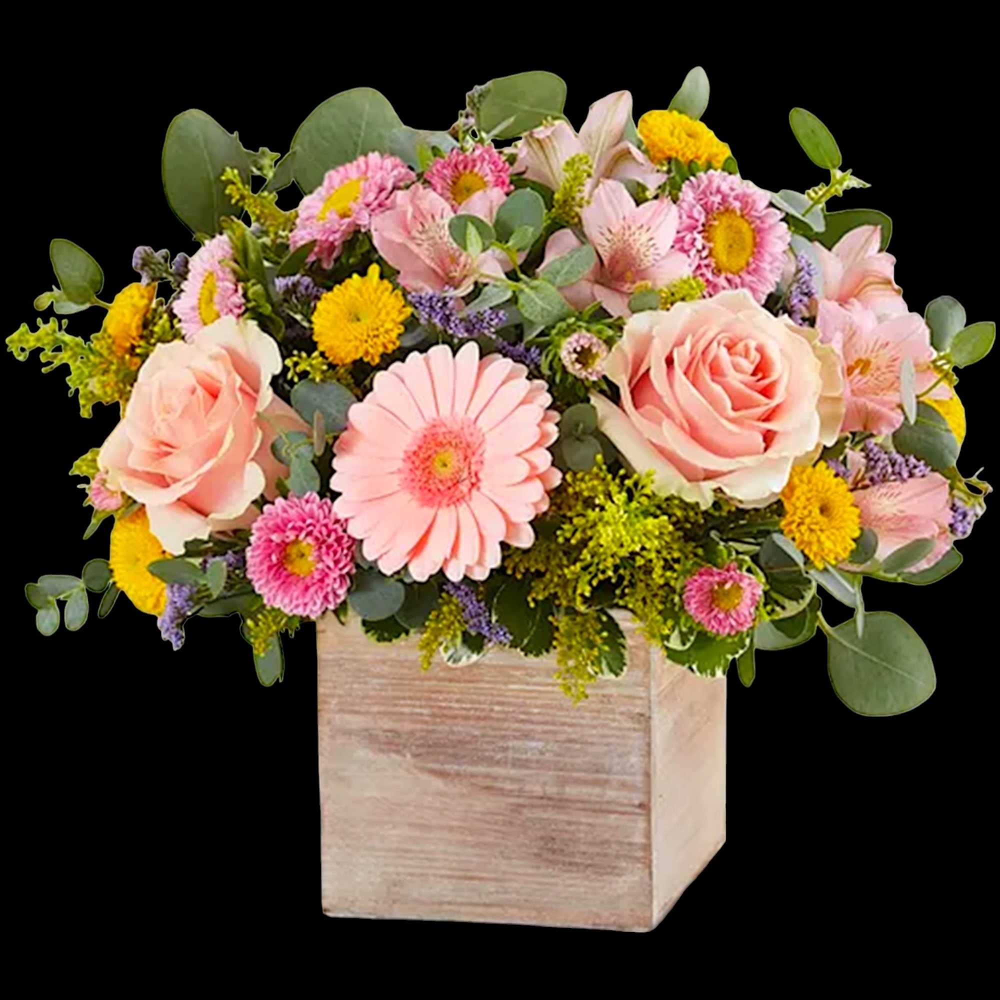 Pink and yellow mixed bouquet in a wooden cube vase