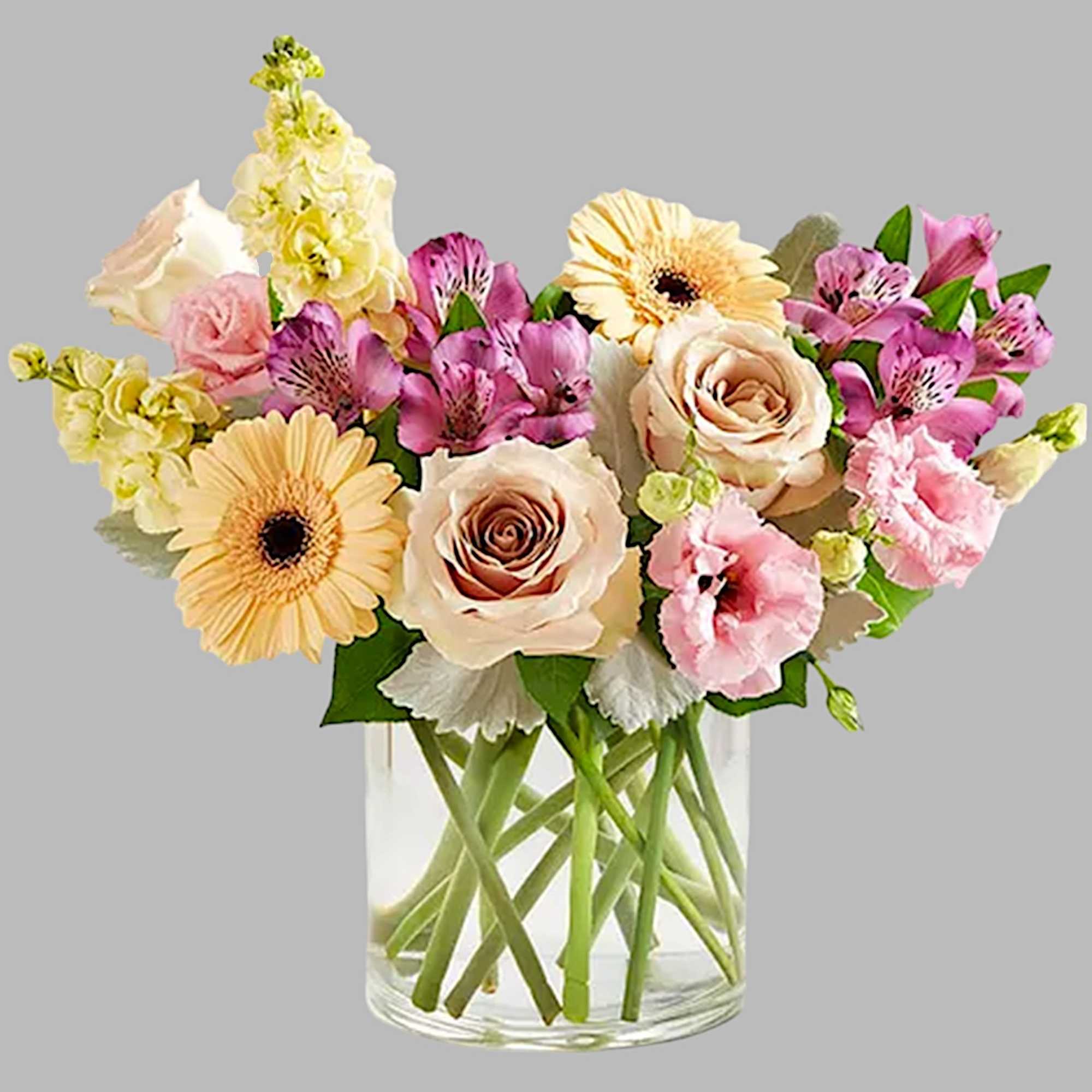 Mixed pink and cream flowers arranged in a clear glass vase, photo 6 of 6