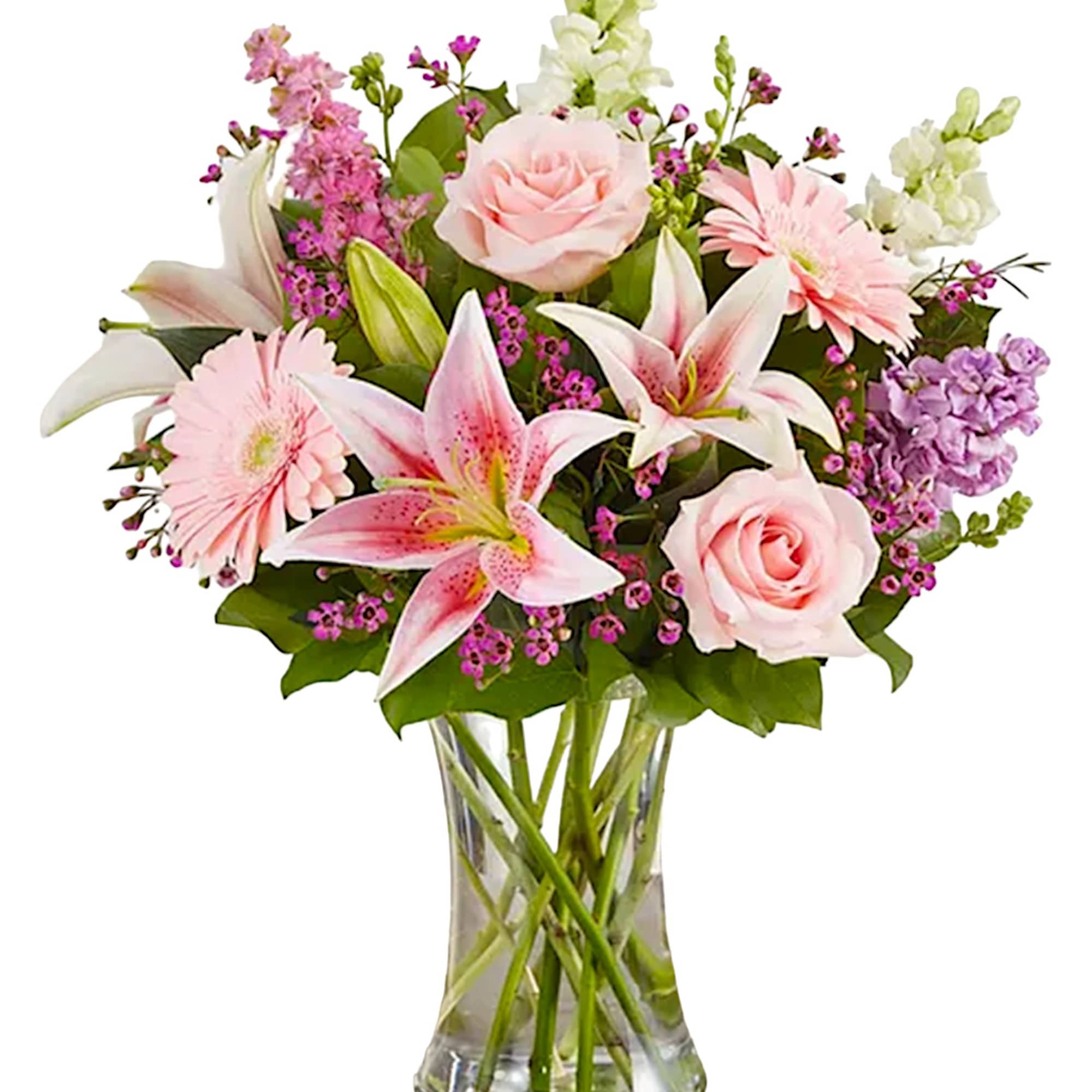 Pink and white mixed flowers arranged in a clear glass vase