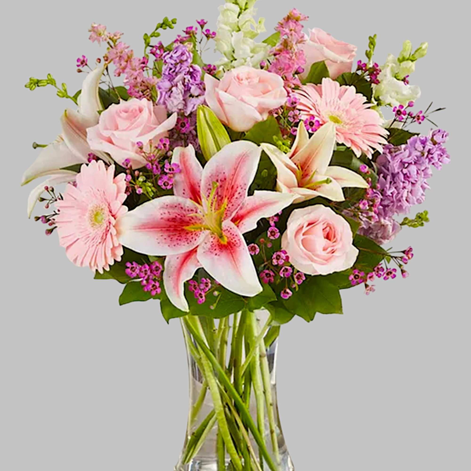 Pink and white mixed bouquet in a clear glass vase