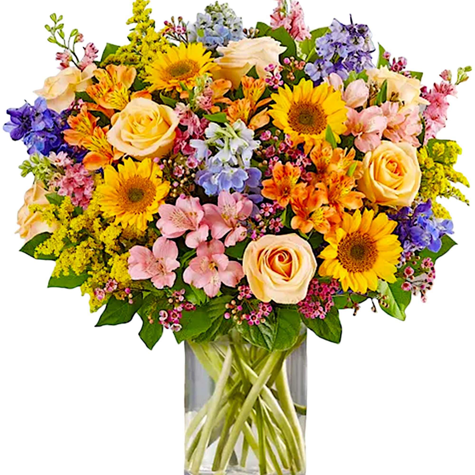 Mixed bouquet of roses, sunflowers, and alstroemeria in a glass vase