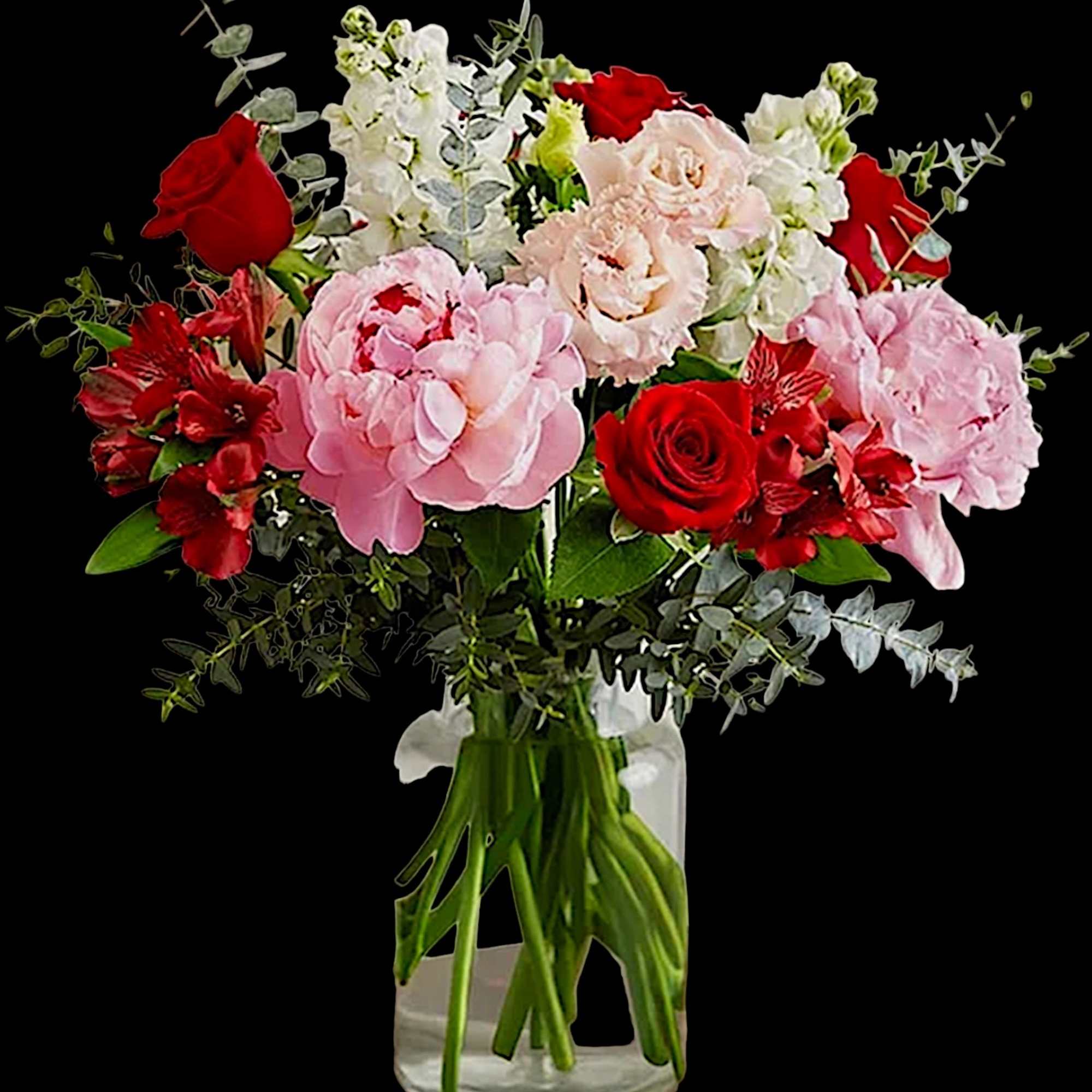 Bouquet of pink and red flowers in a clear glass vase, photo 3 of 4