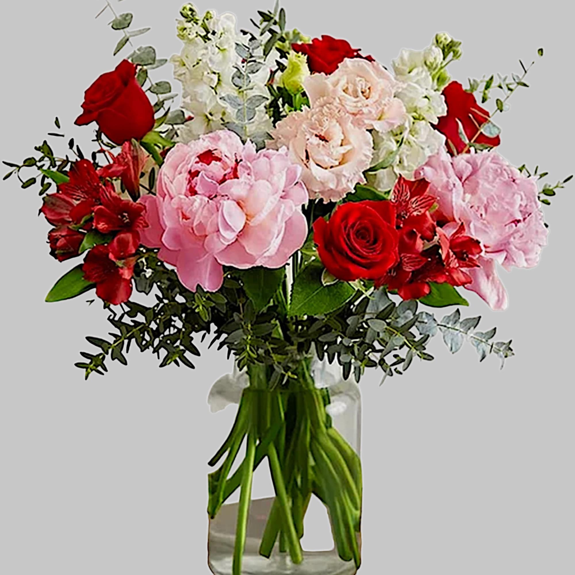 Bouquet of pink and red flowers in a clear glass vase, photo 4 of 4