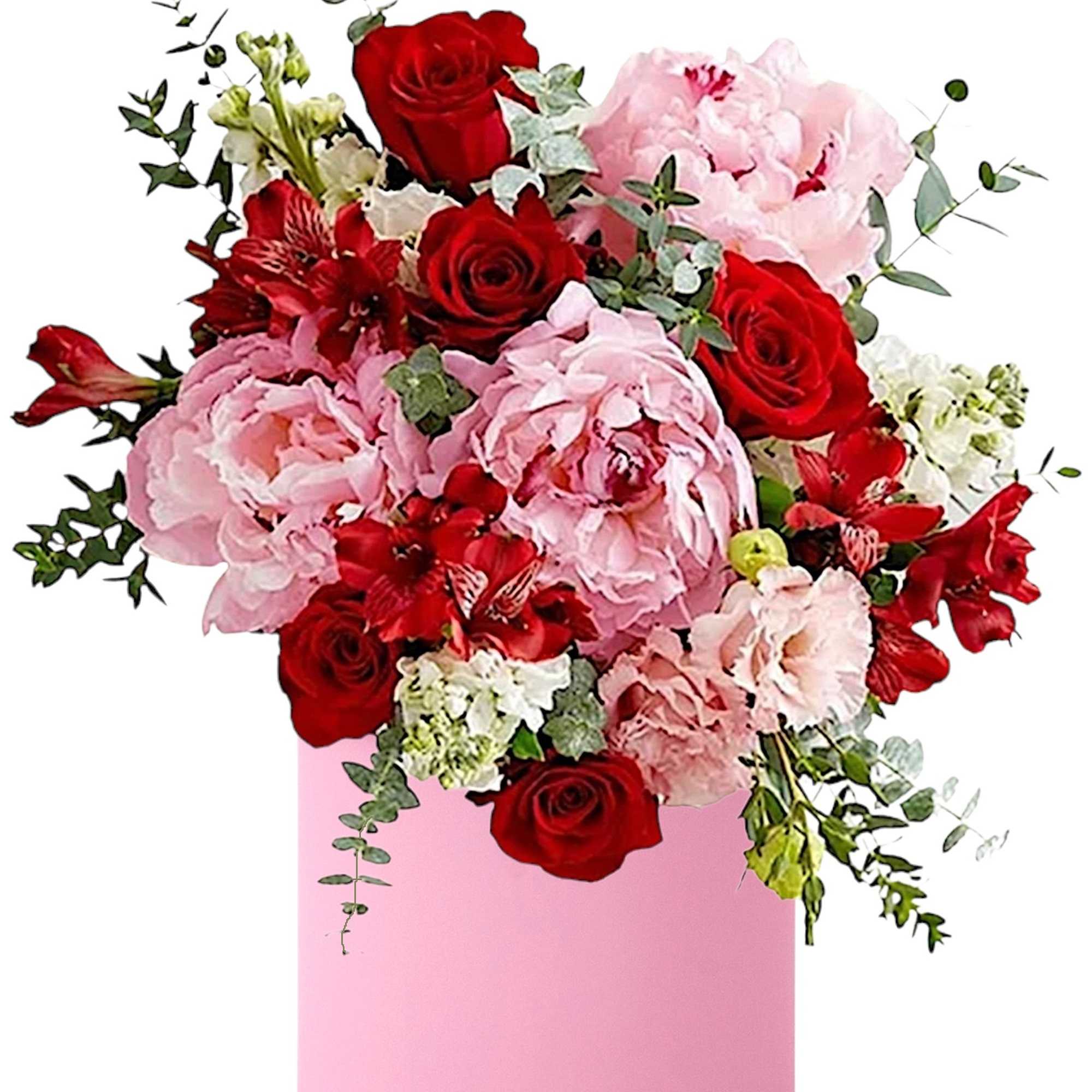 Pink and red floral arrangement in a pink cylindrical box